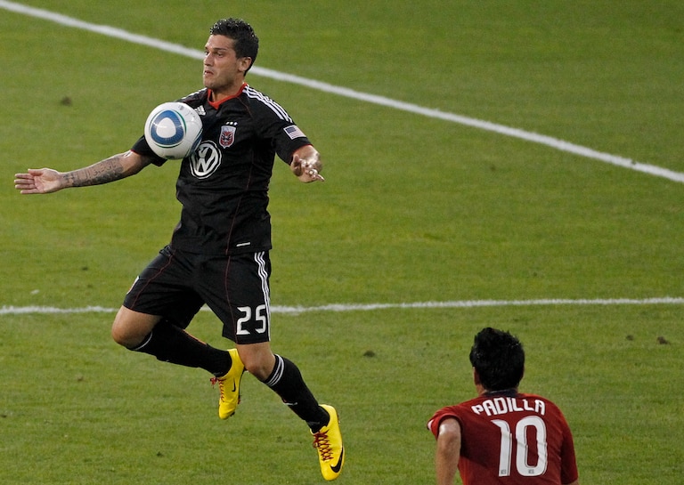 D.C. United's Santino Quaranta traps the ball in front of Chivas USA's Jesus Padilla during the first half of a soccer game, Saturday, May 29, 2010, in Washington. (AP Photo/Haraz N. Ghanbari)