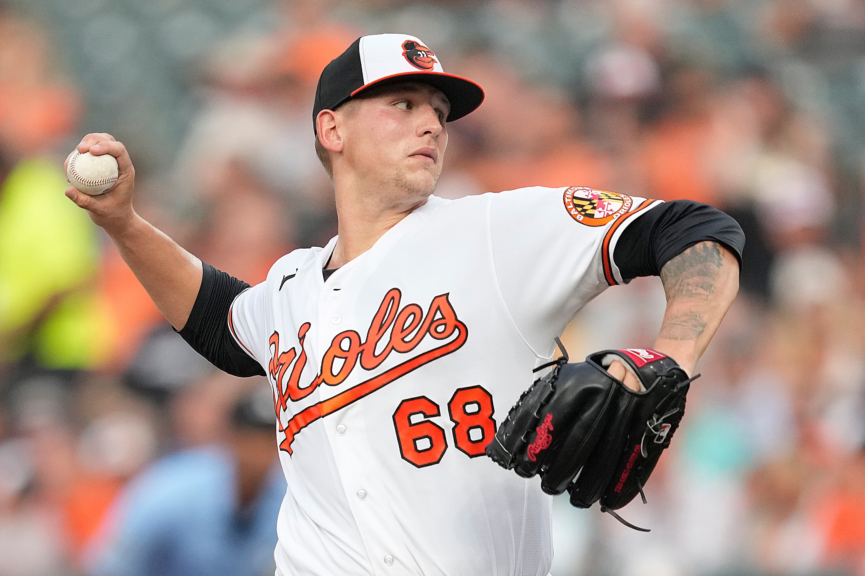 Tyler Wells #68 of the Baltimore Orioles pitches in the fist inning against the Los Angeles Dodgers at Oriole Park at Camden Yards on July 18, 2023 in Baltimore, Maryland.