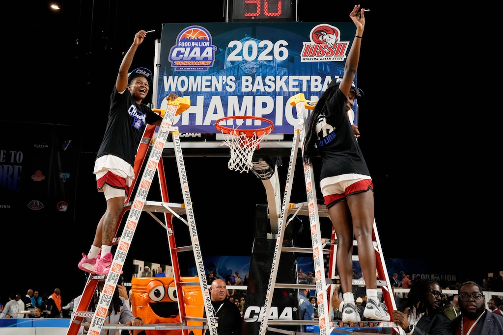 Winston Salem’s Ah’Kiyah Pye, left, holds up a section of net she cut with her teammate after defeating Fayetteville State in the CIAA Women’s championship game in Baltimore, Md., on Saturday, February 28, 2026.