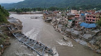 A drone view of a bridge damaged by flash flooding along the Tadi River in the Devighat area of Nuwakot district, Nepal, Saturday, Aug. 29, 2026. (AP Photo/Rajesh Kumar Singh)