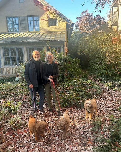 Susan Van Buren and her husband Peter with their dogs at their home in Bolton Hill in 2025.