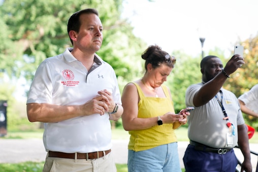 Maryland Senate President Bill Ferguson, second from left, speaks with attendees at a rally at Patterson Park in Baltimore, Md. on Friday, June 12, 2026. The group of community members and parents gathered a day after U.S. Immigration and Customs Enforcement arrested a student’s parents on Commodore John Rodgers Elementary/Middle School’s temporary campus in East Baltimore.
