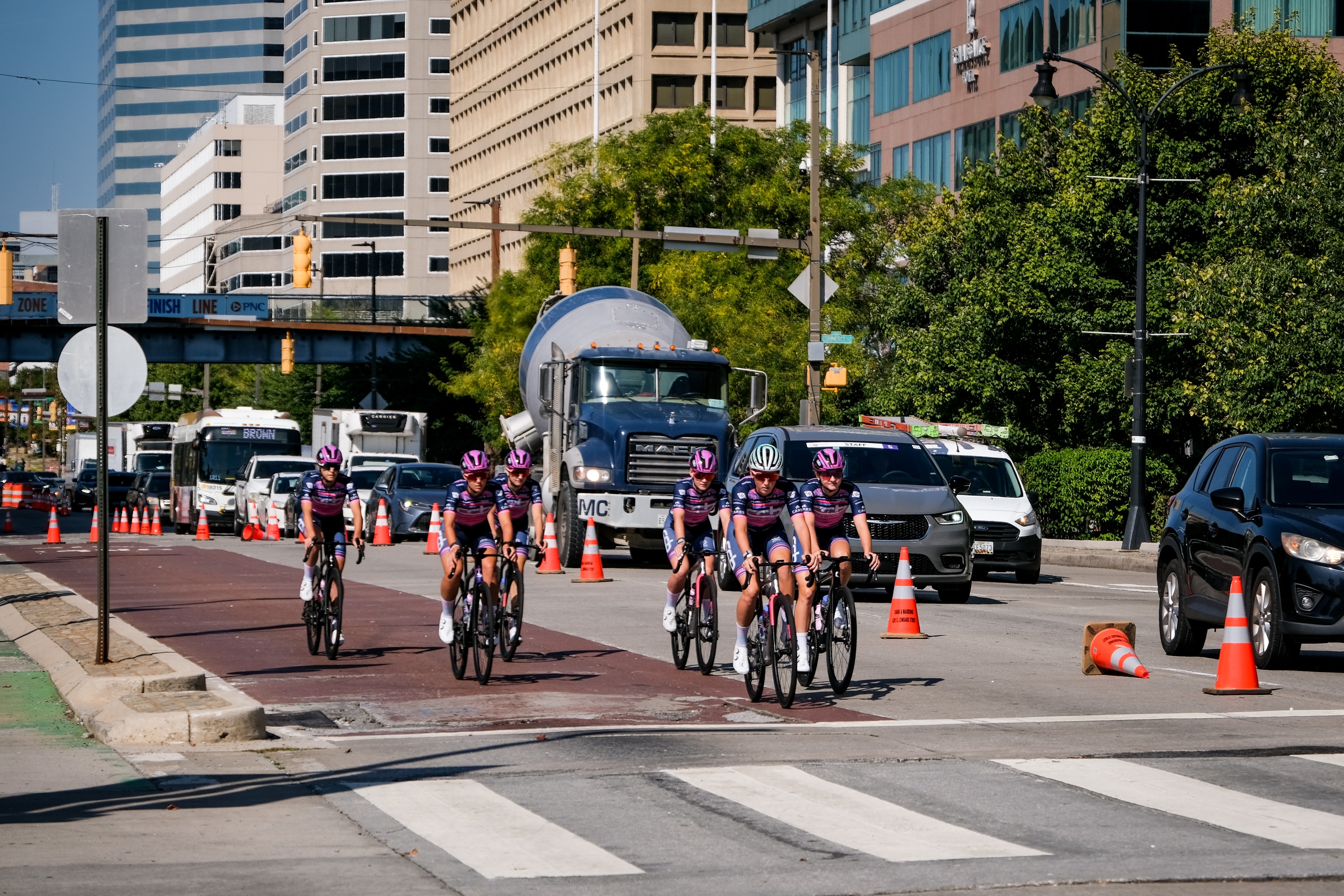 Members of the CCB Women’s Elite Cycling team ride down Pratt Street on Friday as lane closures cause some traffic in downtown Baltimore ahead of Saturday’s race.