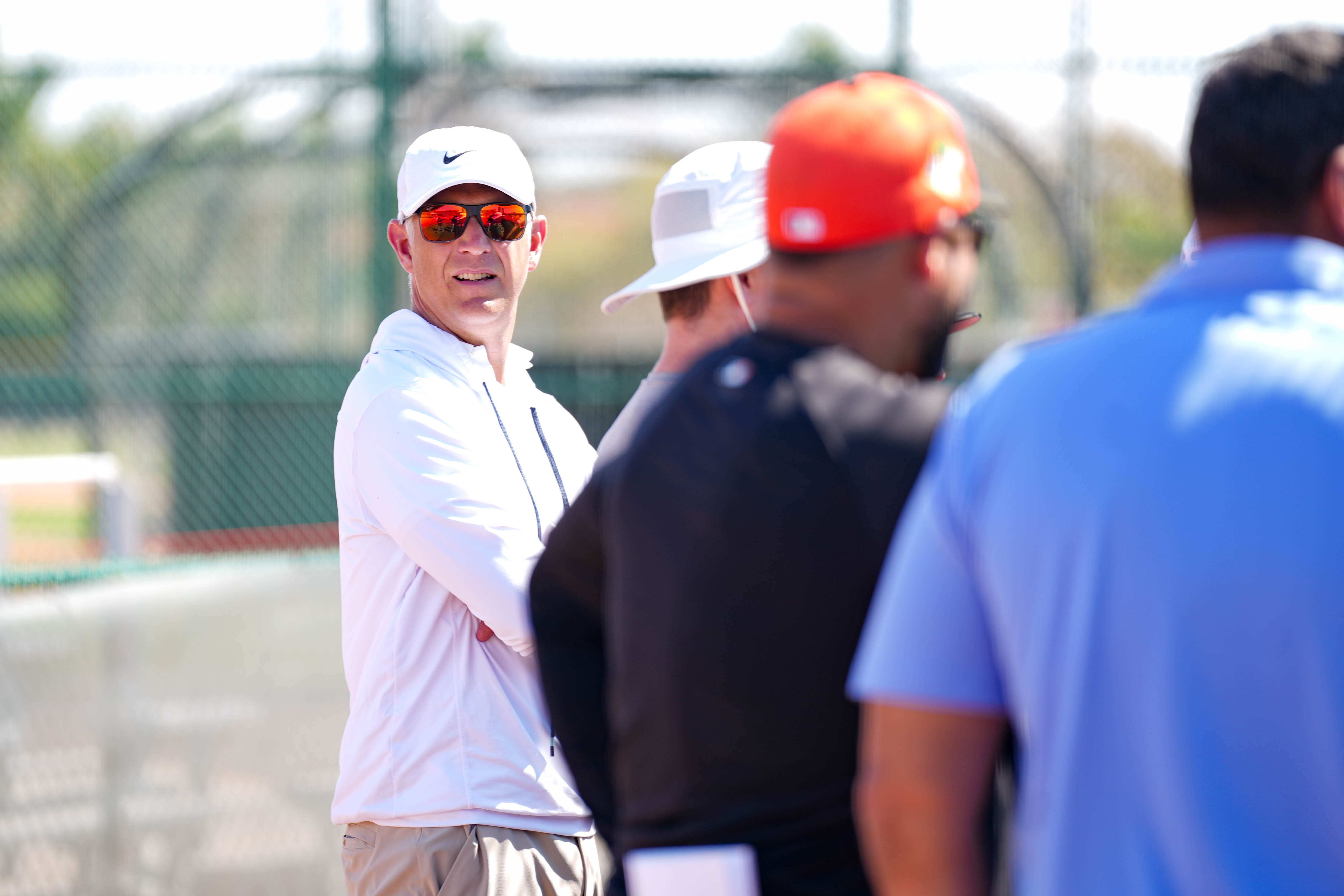 Orioles president of baseball operations Mike Elias, left, observes batting practice ahead of a spring training game against the New York Yankees in February.