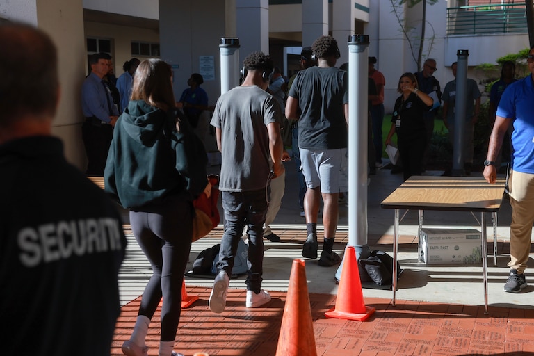 Summer school students walk through a newly installed CEIA OpenGate weapons detection system at Charles W. Flanagan High School on June 24, 2024 in Pembroke Pines, Florida.