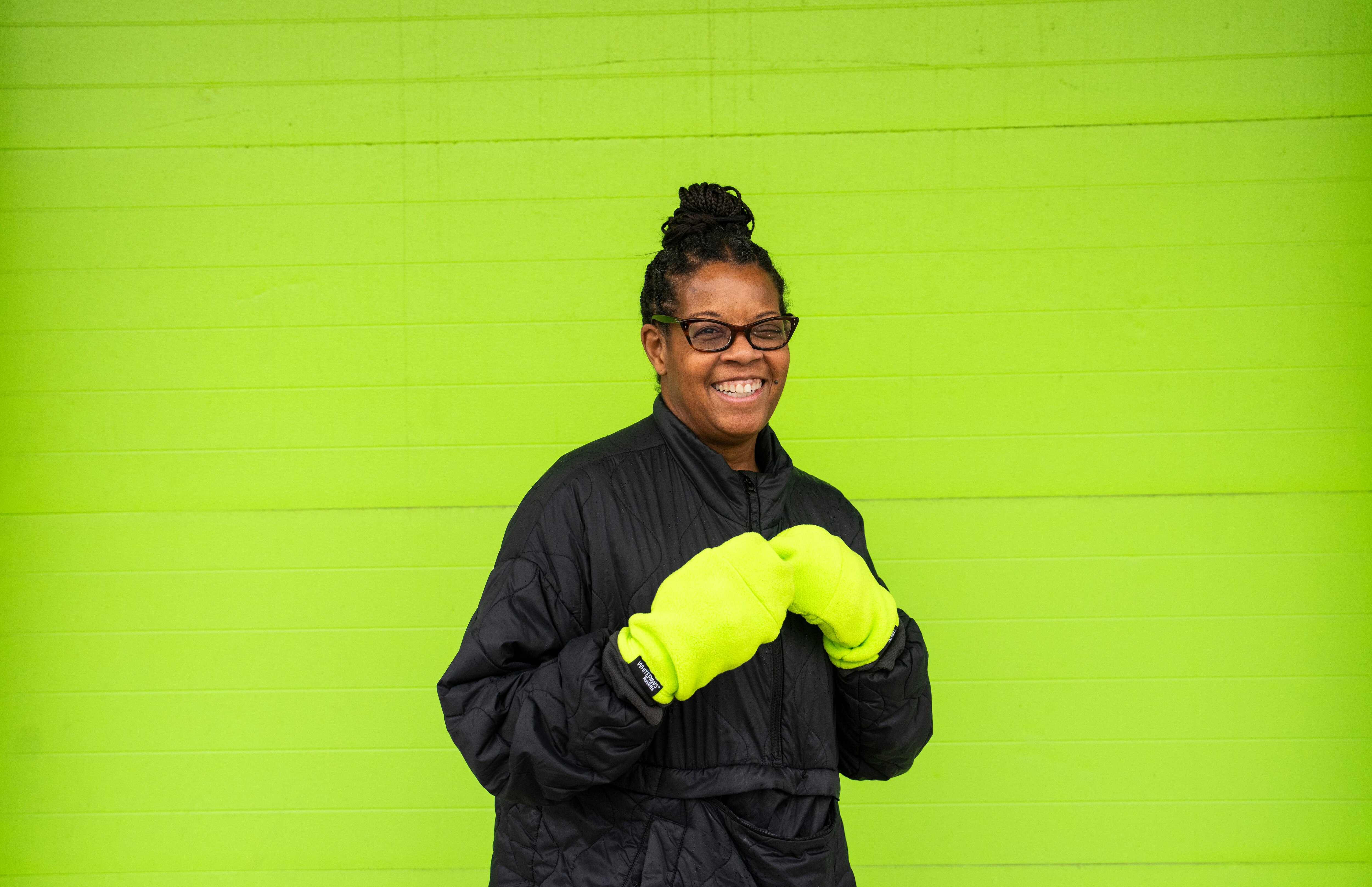 Susan Clayton of WhitePaws Runmitts with her mittens on December 20, 2024 outside of the factory they are made in at Nightmare Graphics. WhitePaws Runmitts is Baltimore-based and -made company that makes running mitts to keep runners' hands warm in the winter and cold mornings and nights.