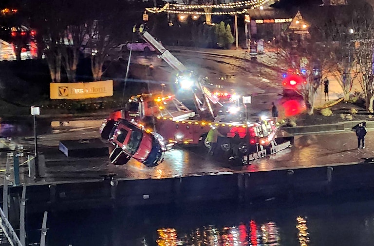 TUESDAY, NOVEMBER 18, 2025 - Crews work to retrieve a car from the Inner Harbor on Tuesday evening after more than a dozen Baltimore fire trucks and police cars lined the area near the Pier 5 Hotel as a vehicle plunged into the water.