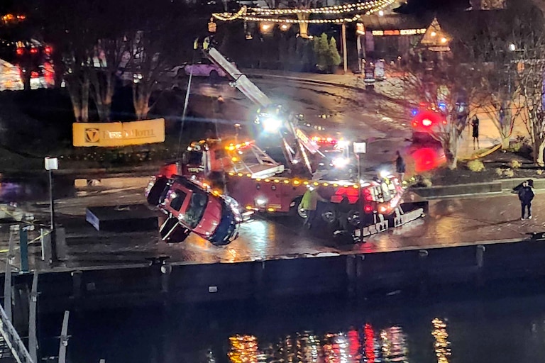 TUESDAY, NOVEMBER 18, 2025 - Crews work to retrieve a car from the Inner Harbor on Tuesday evening after more than a dozen Baltimore fire trucks and police cars lined the area near the Pier 5 Hotel as a vehicle plunged into the water.