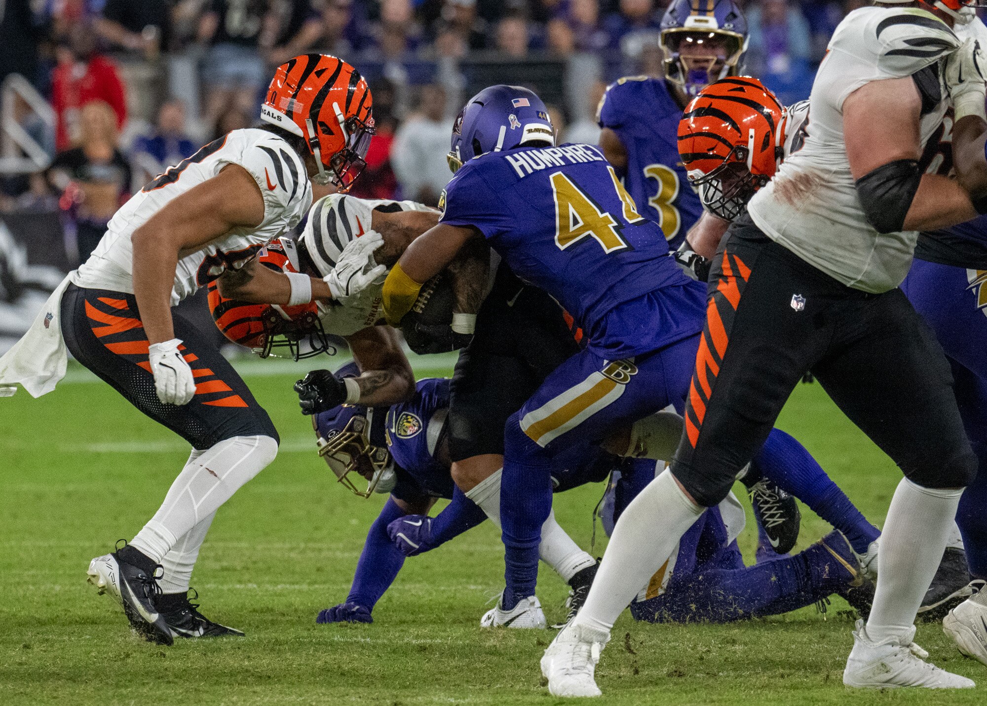 Baltimore Ravens cornerback Marlon Humphrey (44) tackles Cincinnati Bengals running back Chase Brown (30) causing a fumble that was recovered by the Ravens in the 4th quarter on Thursday, November 7, 2024 at M&T Bank Stadium.