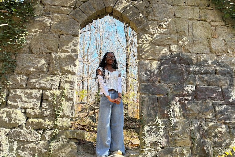 Nailah Agbodjogbe, of Towson, explores the ruins of Daniels, an old company town.