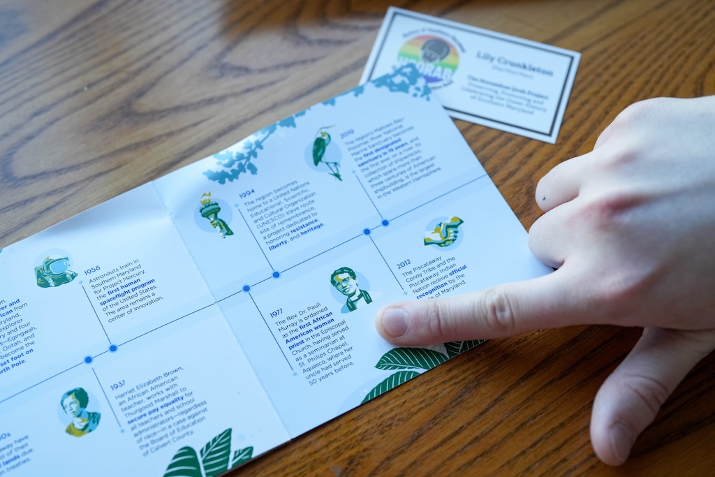Lily Crunkleton goes over information in a pamphlet on Southern Maryland History as she sits in her home in Annapolis, Md., on Monday, March 9, 2026.