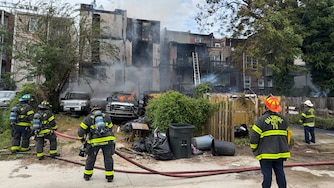 The Baltimore City Fire Department responds to a 3-alarm fire on the 2500 block of Brookfield Avenue in Reservoir Hill on Sunday.