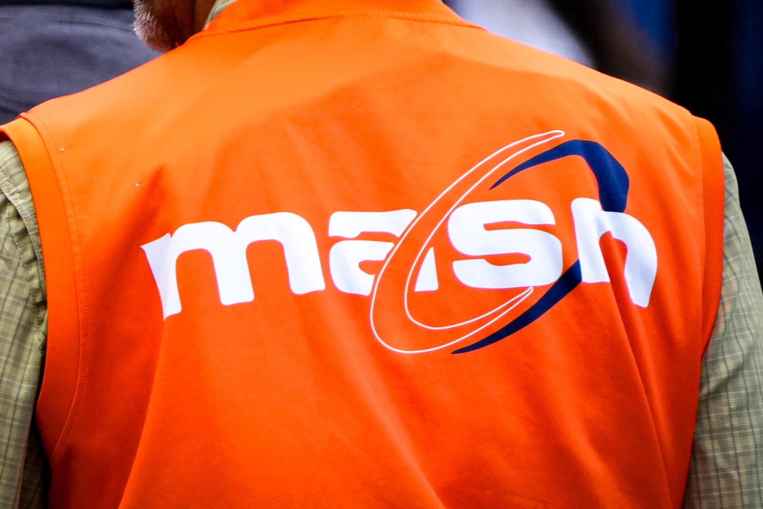 An employee wears a vest with a MASN logo during a game between the Baltimore Orioles and Los Angeles Angels in 2024.