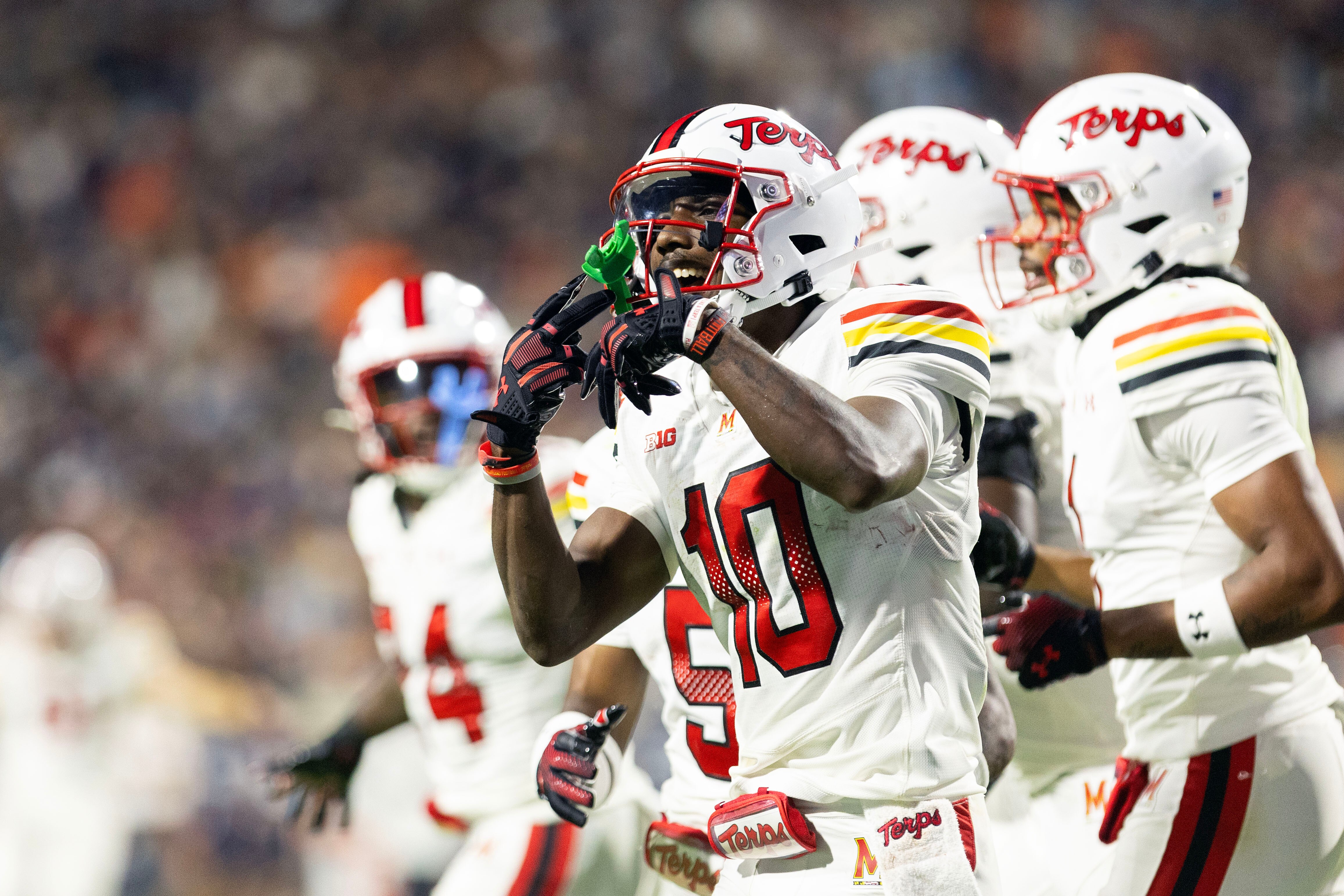 Maryland wide receiver Tai Felton celebrates a touchdown in the first half at Virginia.