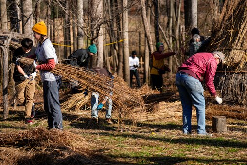 Rebecca Sparks, manager of volunteer services, second from left, helps lead other volunteers in the construction of wigwams at the Irvine Nature Center’s Native American Educational Site in Owings Mills, Md., on Thursday, November 13, 2025. The Center will host a free Indigenous Peoples Celebration on Sunday, November 23.