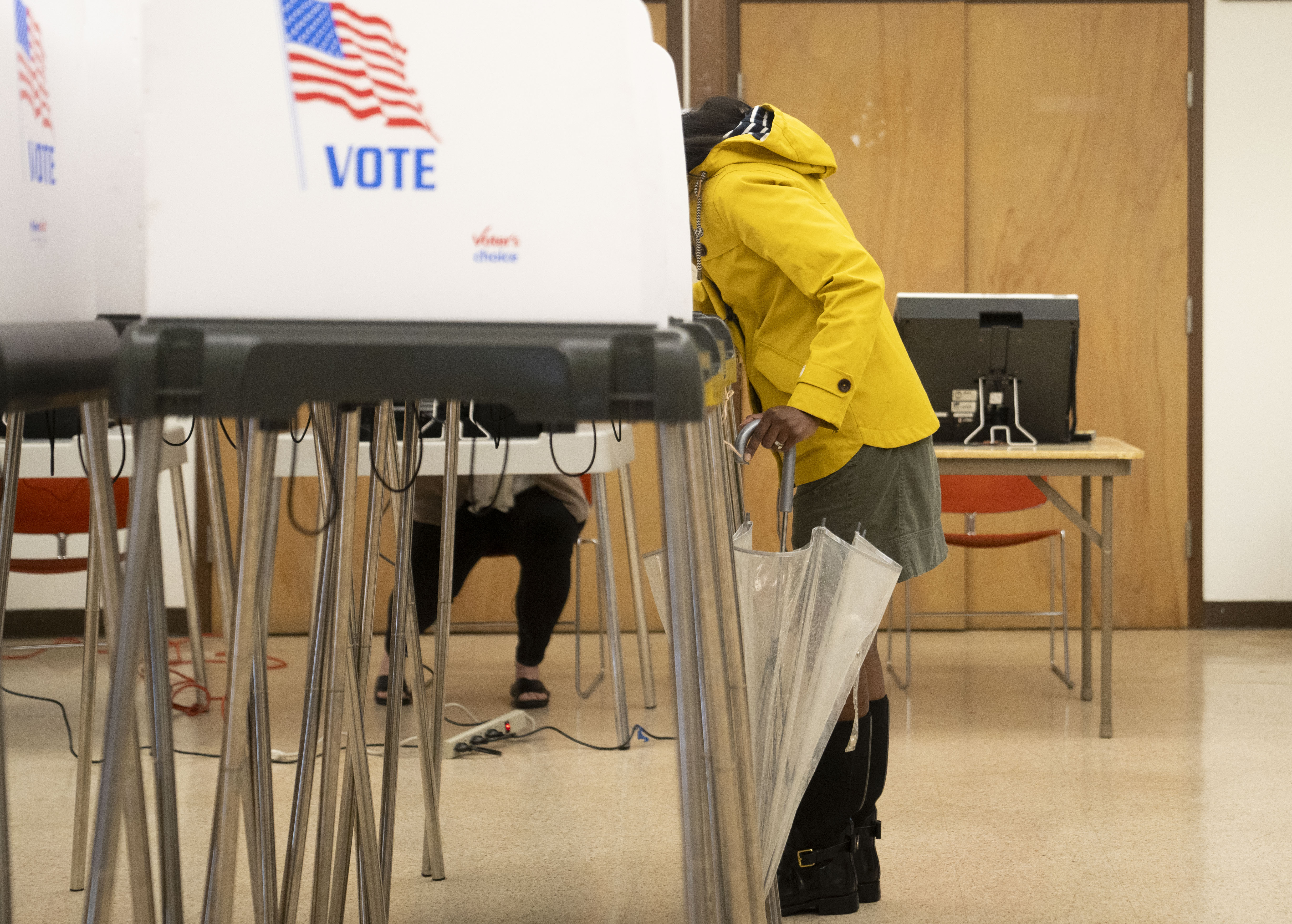 Andrea Young Ryan finishes filling out her ballot at  Hatton Senior Center in Baltimore on Tuesday.