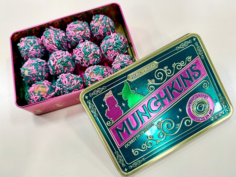 Dunkin’, which has a slew of locations across the county, offers a special “Wicked”-themed Munchkins tin, which houses their Munchkin donut holes covered in pink and green sprinkles.