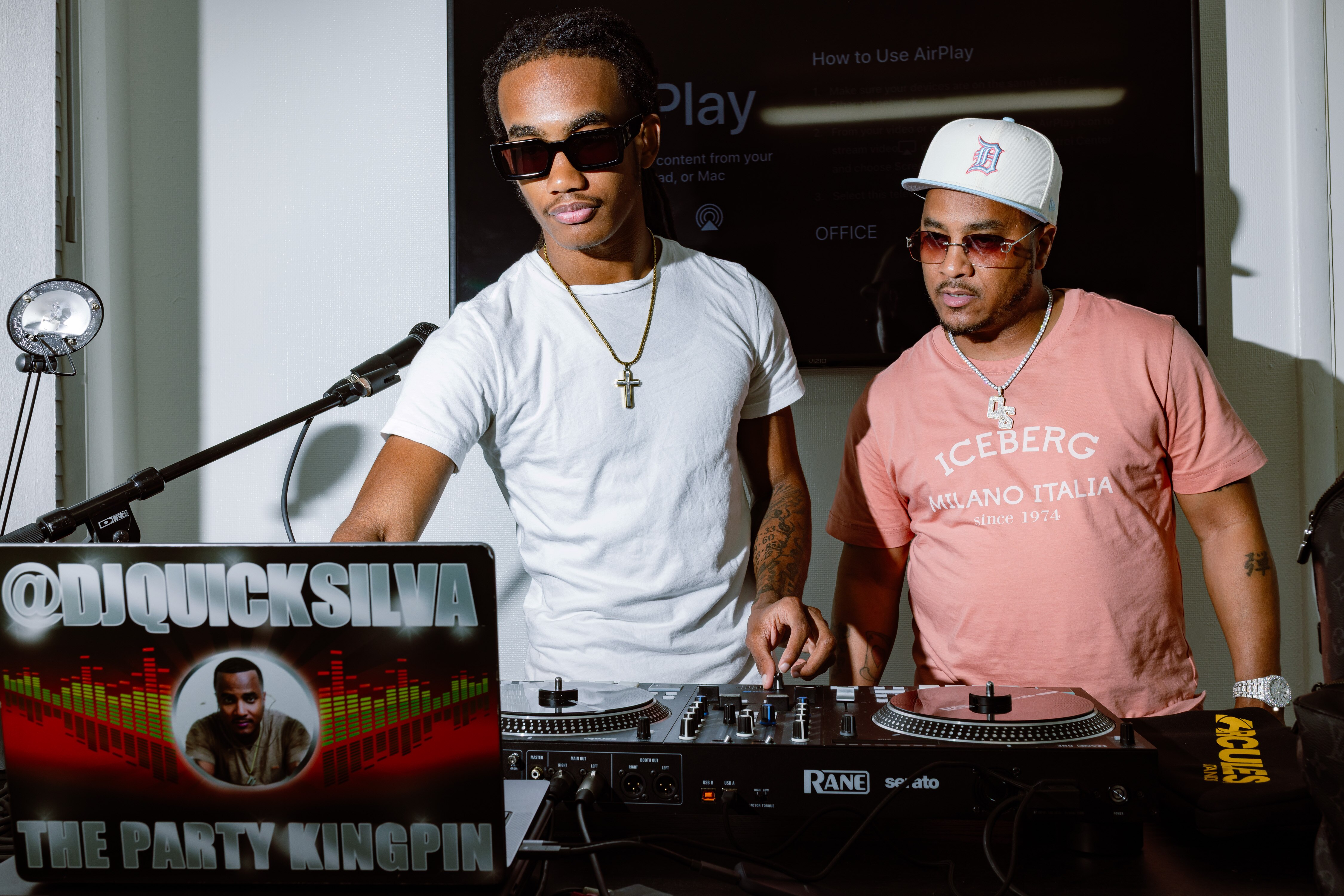 DJ Quicksilva, right, of 92Q, looks on during a DJ battle with his son, DJ Sauce God, at the office of Unruly Records earlier this month. 