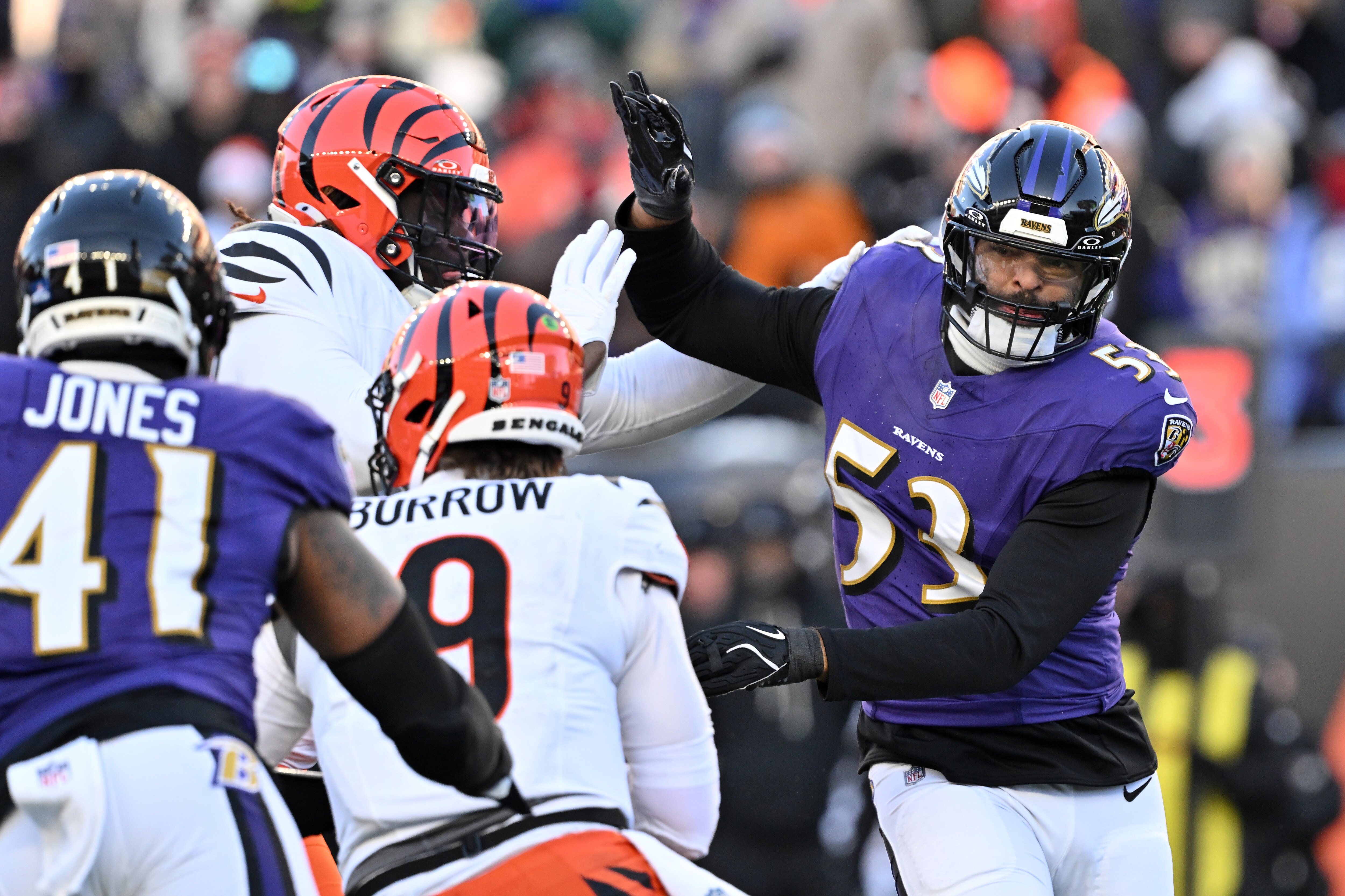 Ravens pass rushers Kyle Van Noy and Dre’Mont Jones pressure Bengals quarterback Joe Burrow.