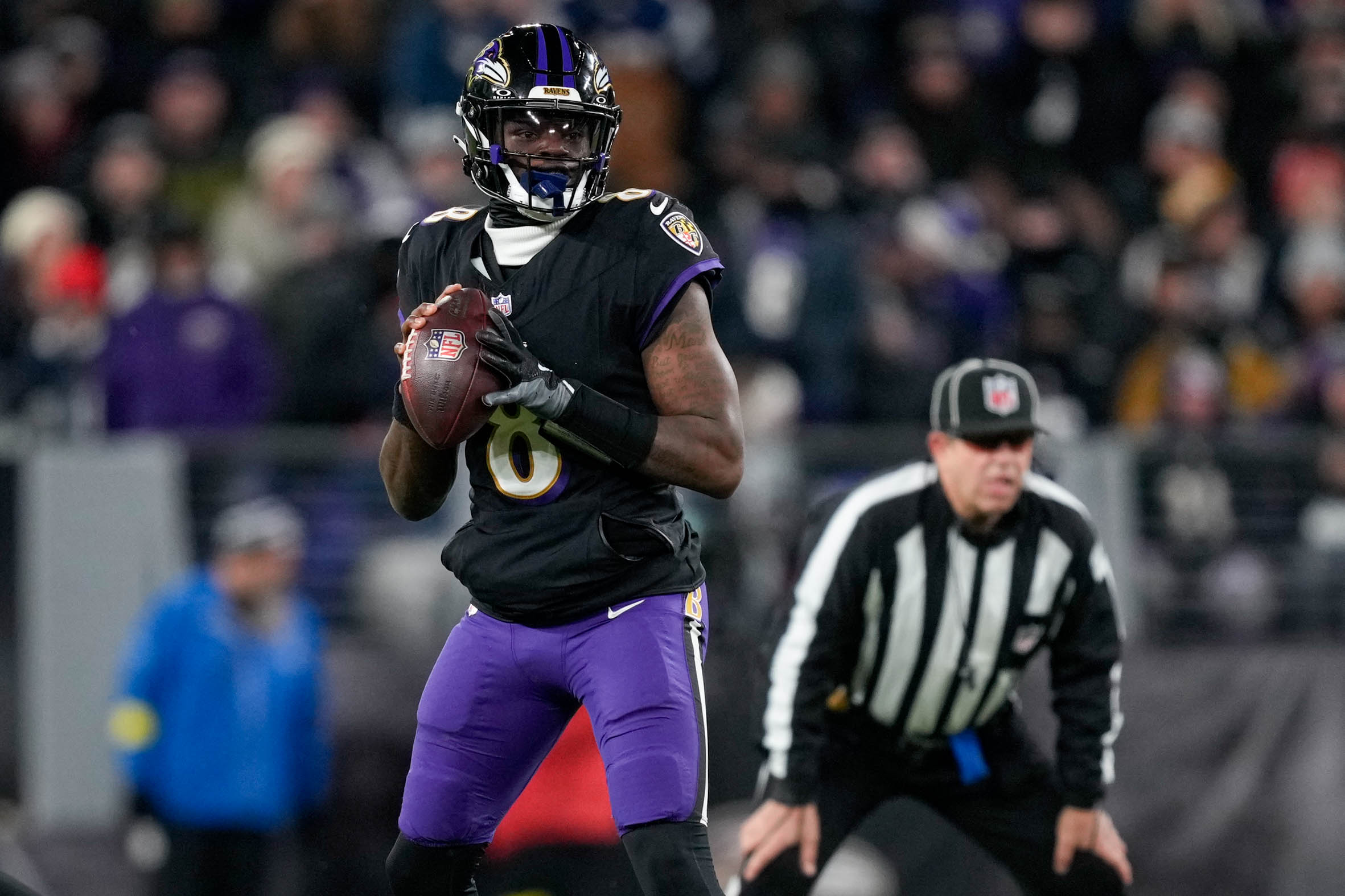 Ravens quarterback Lamar Jackson drops back to pass in the second quarter against the New England Patriots in Week 16.
