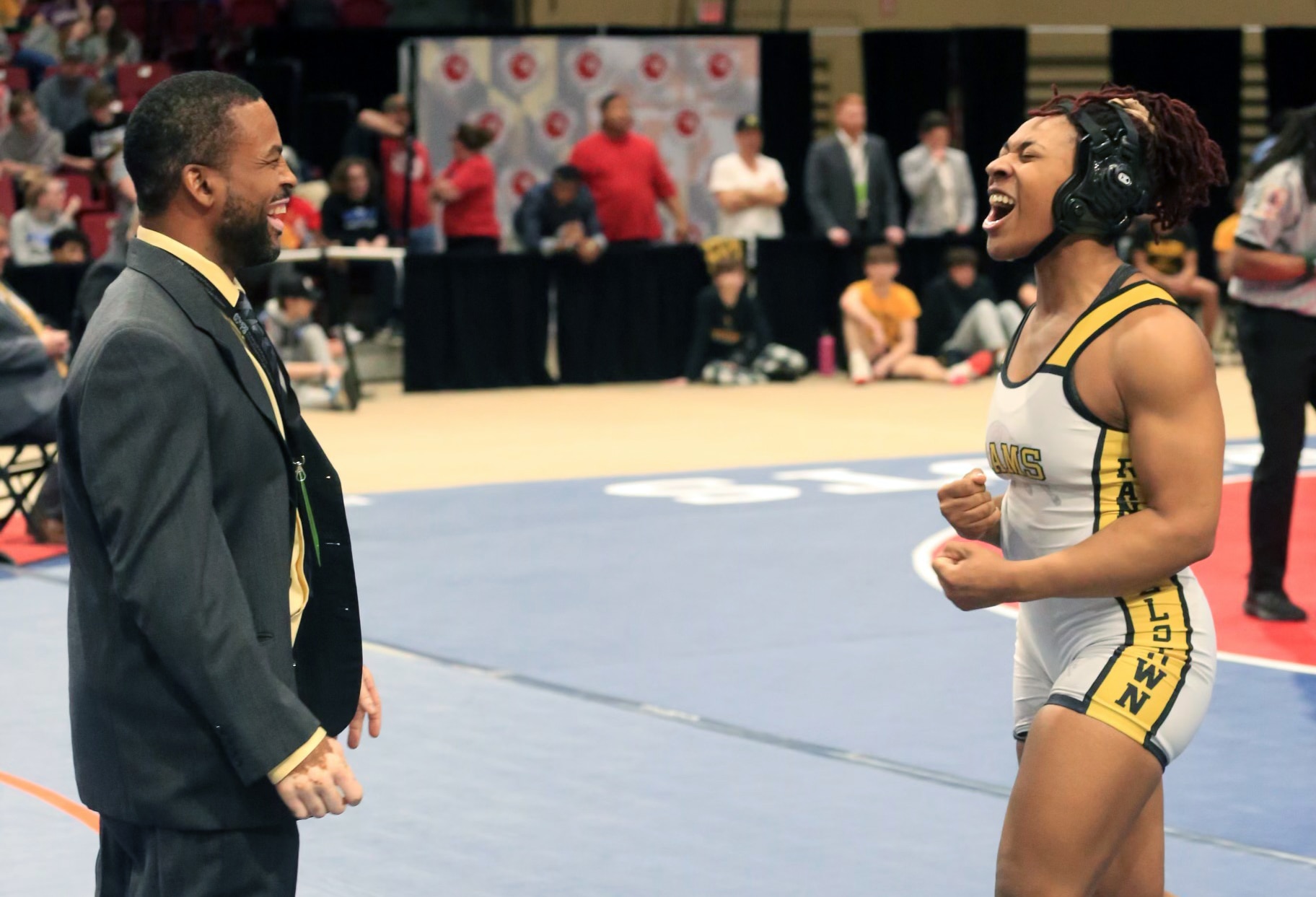 Randallstown coach Earnest Davison (left) guided Randallstown's 170-pound junior Ugochi Anunobi (right) to her second straight all-girls' state championship on Saturday at Show Place Arena in Upper Marlboro.