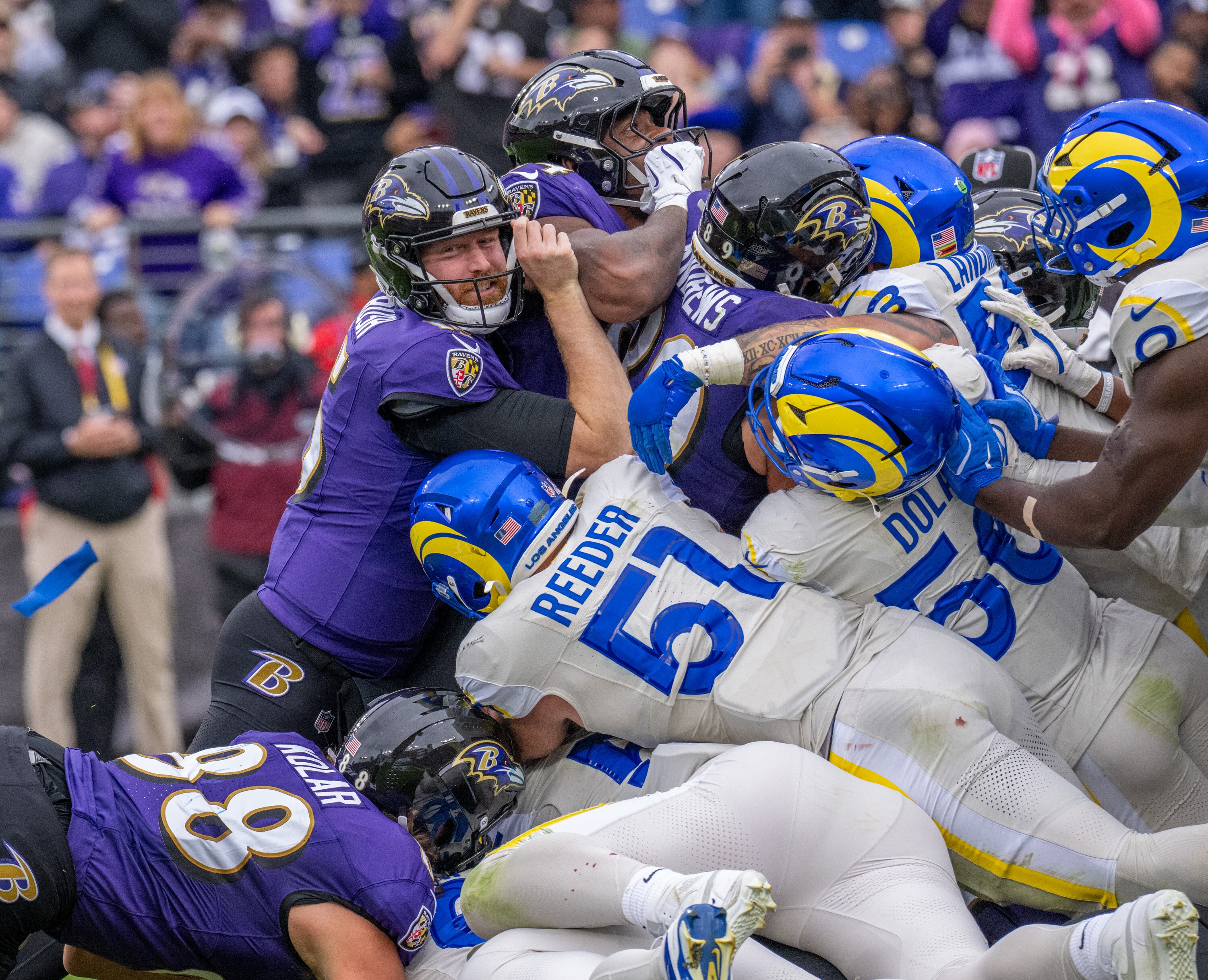 Sunday, Oct. 12, 2025 —Baltimore Ravens quarterback Cooper Rush (15) pushes the pile to no avail as the Ravens fail to score from just outside the goal line towards the end of the second quarter as the Ravens host the Los Angeles Rams at M&T Bank Stadium.