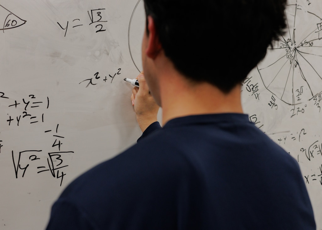 An undocumented student revisits a math problem from class earlier that day at his school in Baltimore, Maryland.