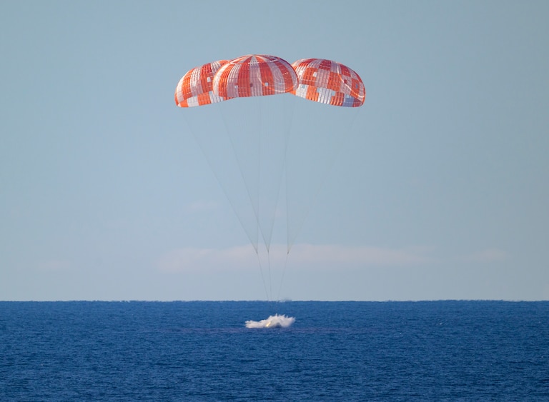 NASA’s Orion spacecraft with Artemis II crewmembers NASA astronauts Reid Wiseman, commander; Victor Glover, pilot; Christina Koch, mission specialist; and CSA (Canadian Space Agency) astronaut Jeremy Hansen, mission specialist aboard is seen as it lands in the Pacific Ocean off the coast of California, Friday, April 10, 2026. NASA’s Artemis II mission took Wiseman, Glover, Koch, and Hansen on a 10-day journey around the Moon and back to Earth. Following a splashdown at , NASA, U.S. Navy, and U.S. Air Force teams are working to bring the crewmembers and Orion spacecraft aboard USS John P. Murtha.
