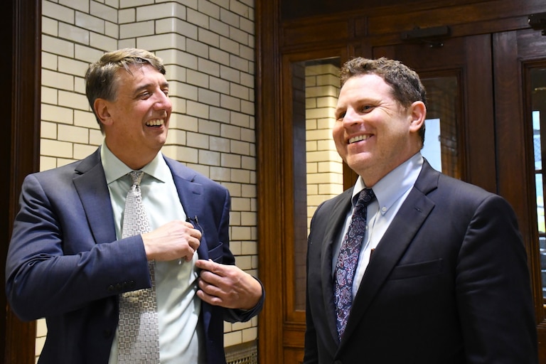Sen. Guy Guzzone, left, and Del. Ben Barnes, right, share a laugh before briefing reporters on a deal reached for next year's state budget at the State House on Wednesday, April 3, 2024.