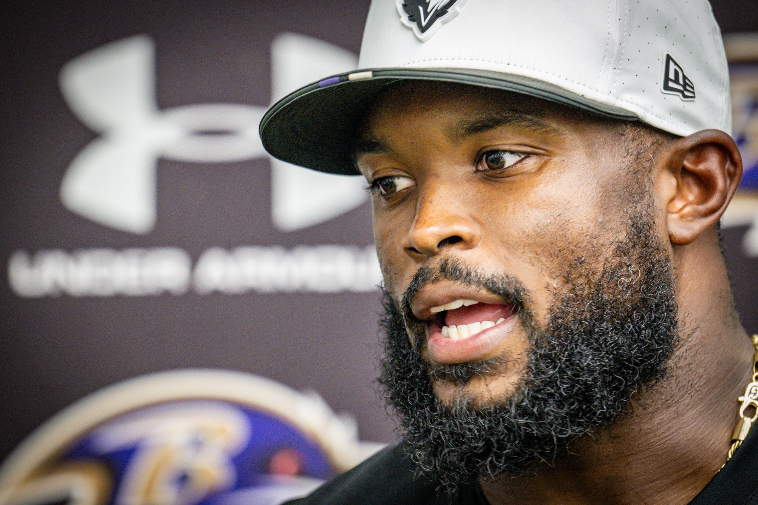 Ravens defensive coordinator Zach Orr takes questions from reporters following practice on July 31.