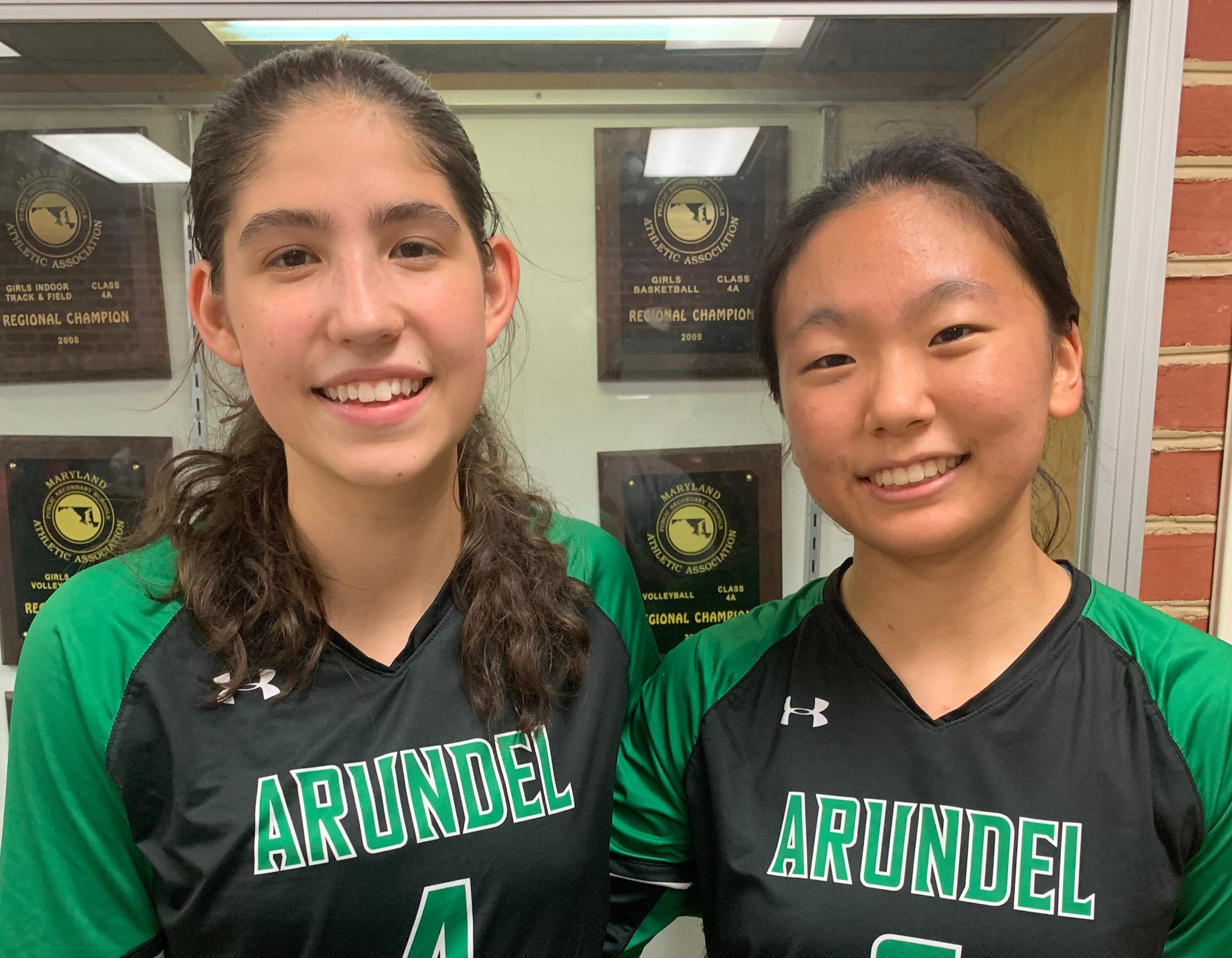 Seniors Audrey Owens (left) and Emily Liu led the way in top-ranked Arundel’s victory over Reservoir Tuesday. Owens had a team-high 17 kills and Liu finished with 33 assists as the Wildcats defeated No. 2 Reservoir in five sets.