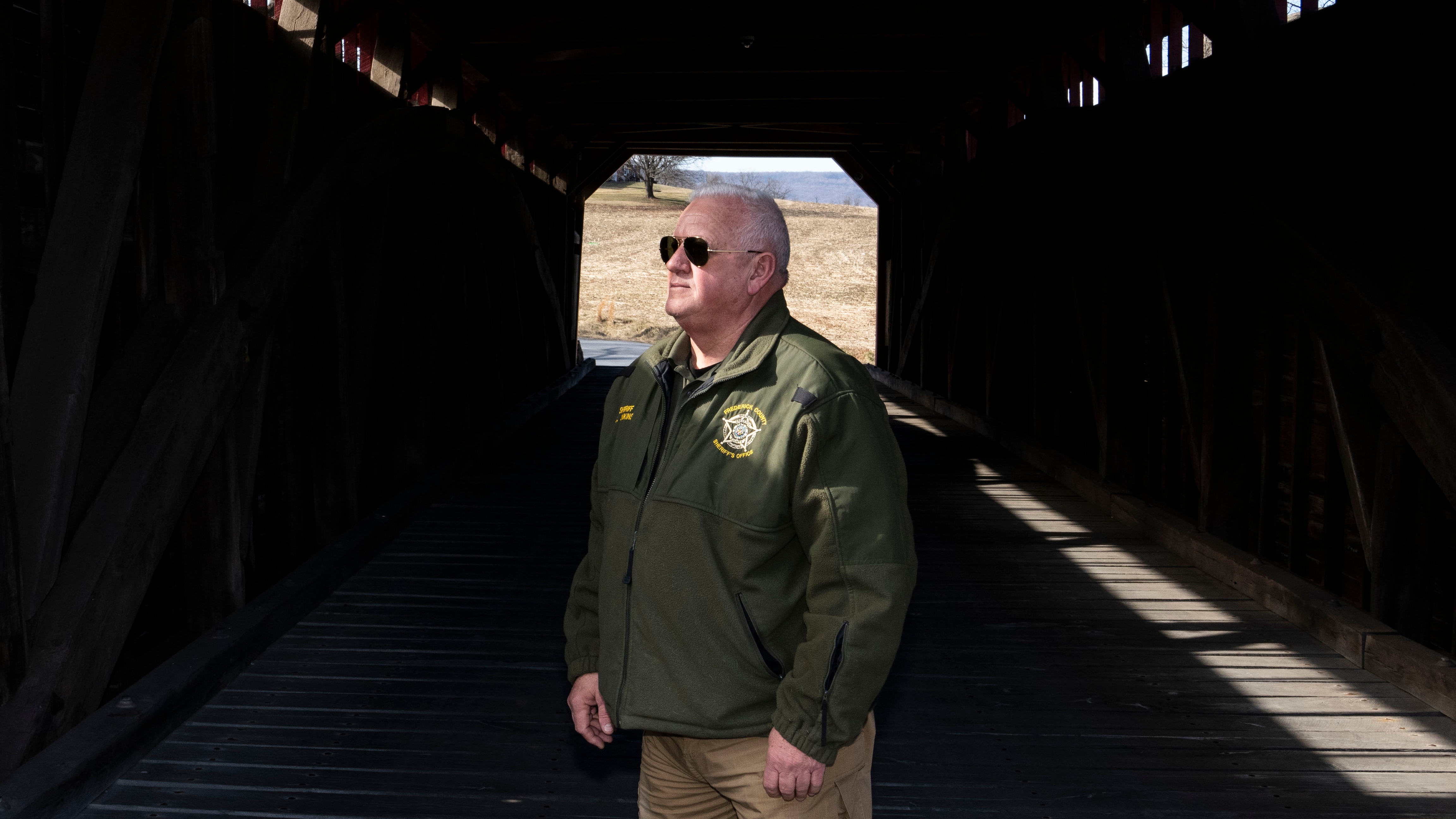 Sheriff Chuck Jenkins at the Utica Mills Covered Bridge in Thurmont. When he launched his first campaign announcement, he used a photograph of himself here.