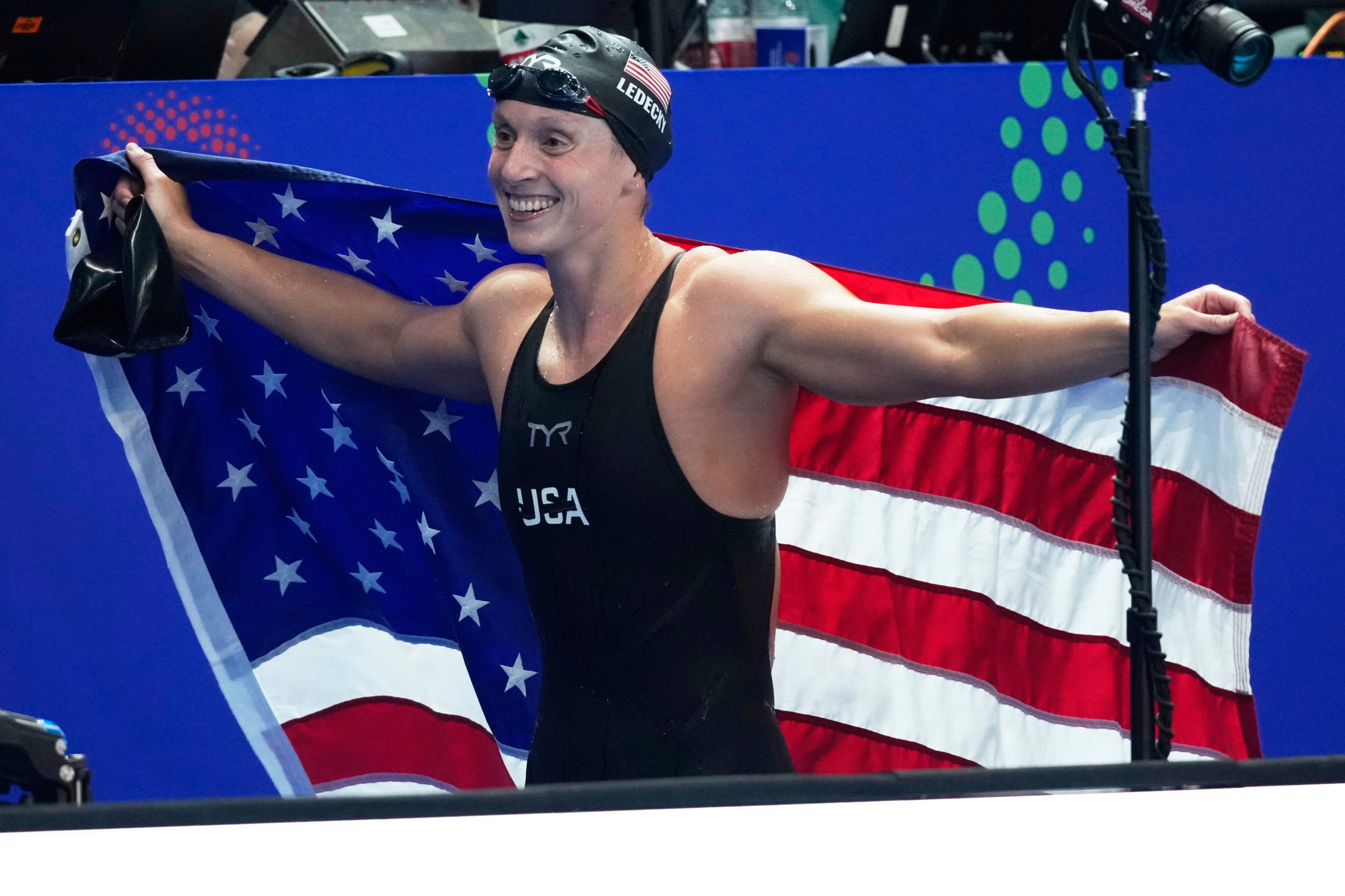Katie Ledecky of the United States celebrates after winning gold medal in the women's 1500m freestyle final at the World Aquatics Championships in Singapore, Tuesday, July 29, 2025.