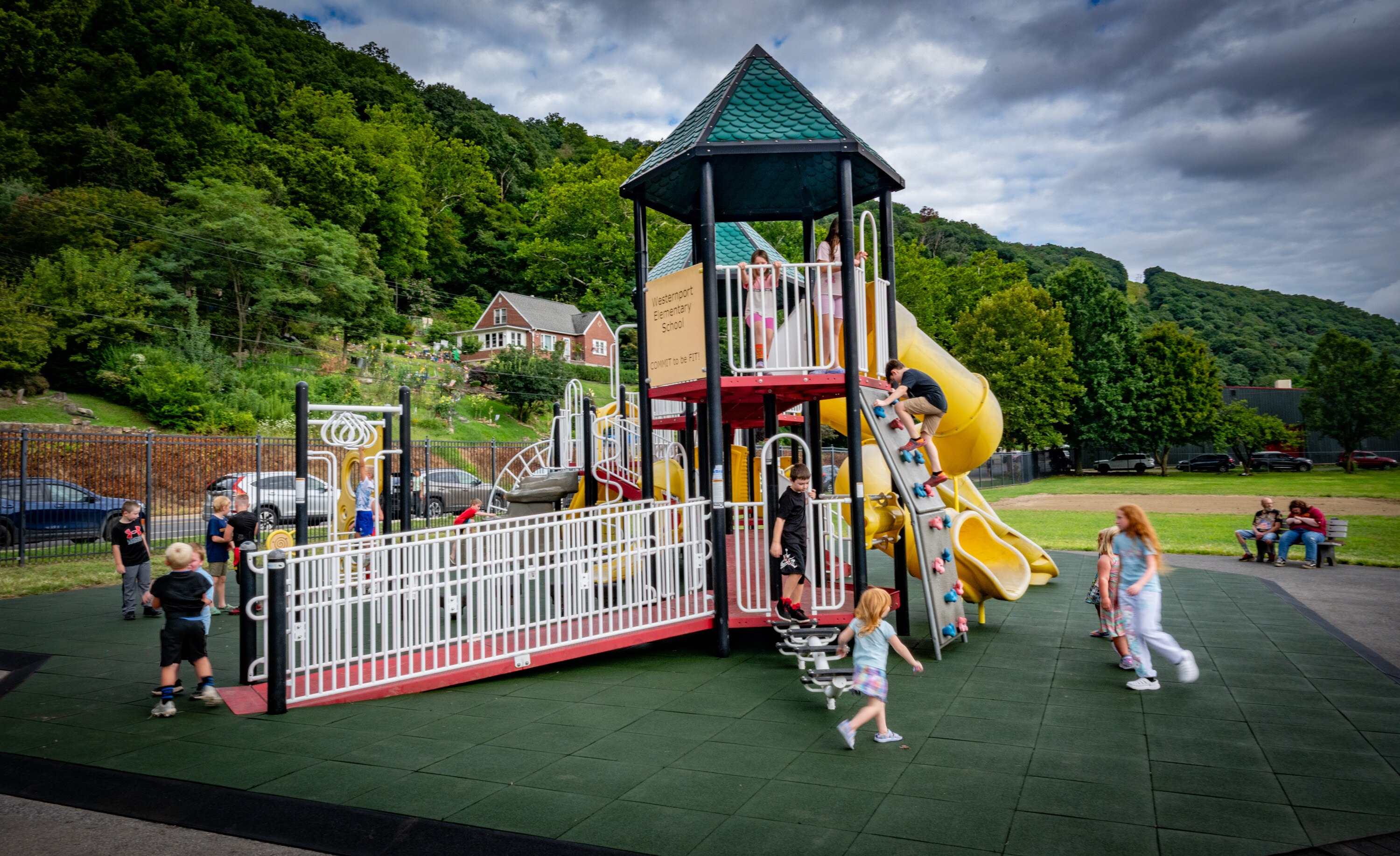 Kids play on the repaired playground during Westernport Elementary’s back-to-school night on Thursday, Aug. 21, 2025.