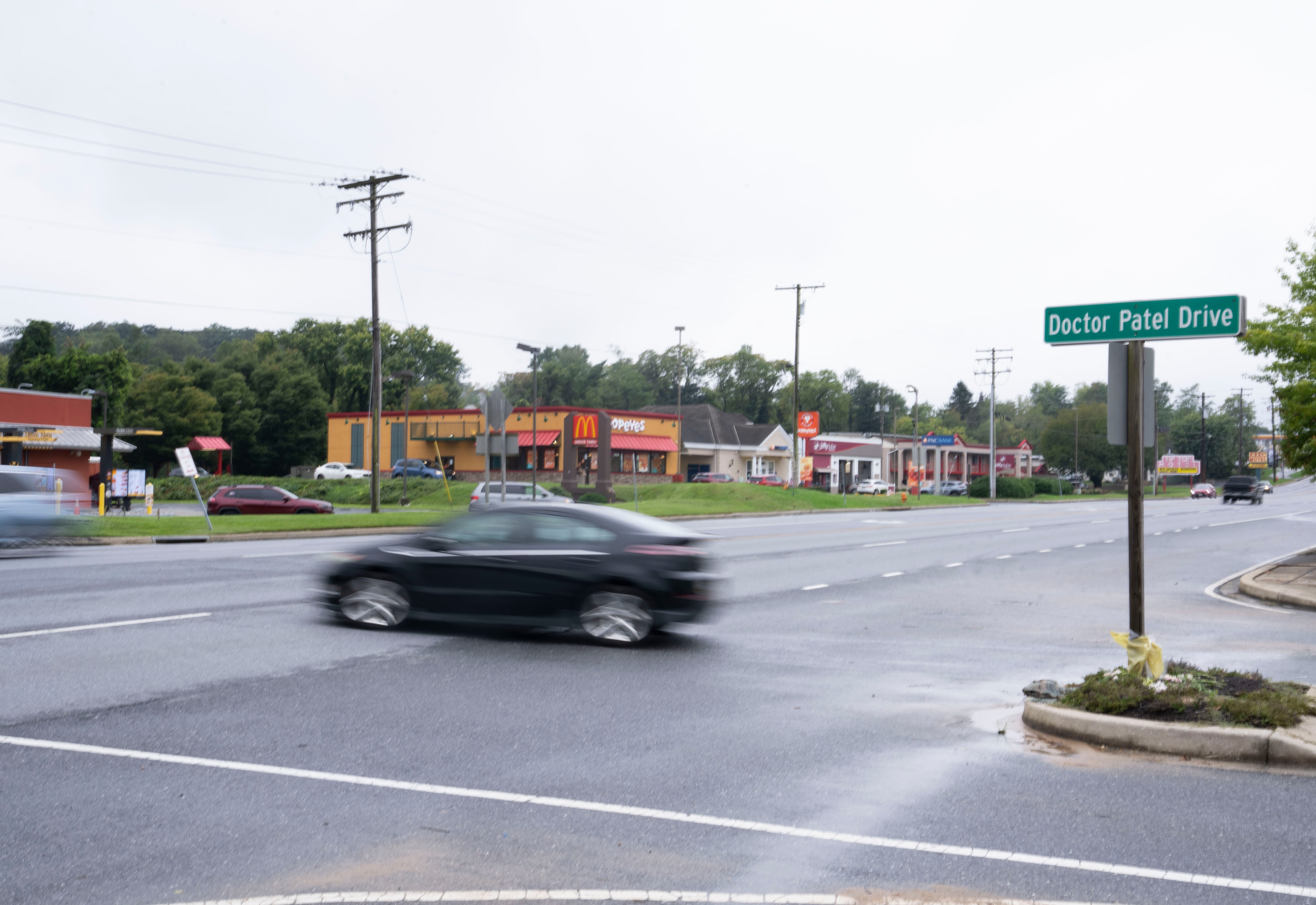 A car crosses across Doctor Patel Drive in Elkridge, Maryland, on Wednesday, Oct. 2, 2024.