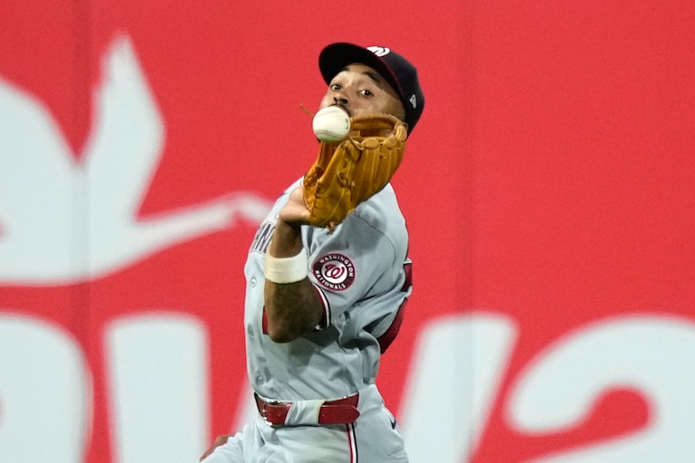 Washington Nationals second baseman Nasim Nuñez cannot catch a fly by Philadelphia Phillies' Brandon Marsh during the eighth inning.