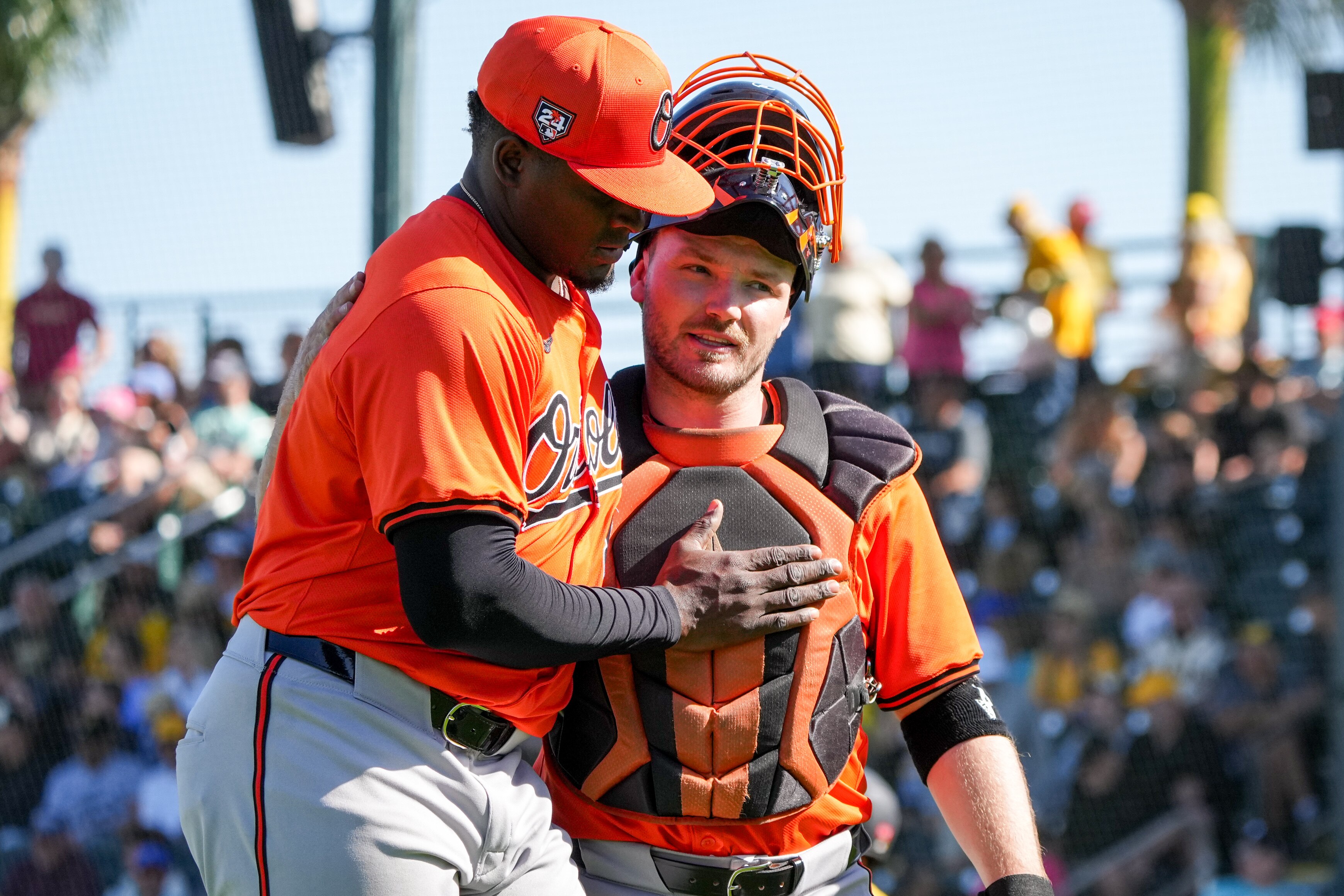 Catcher Maverick Handley, right, during spring training last season, likes what he sees from three pitchers the Orioles protected over the offseason.