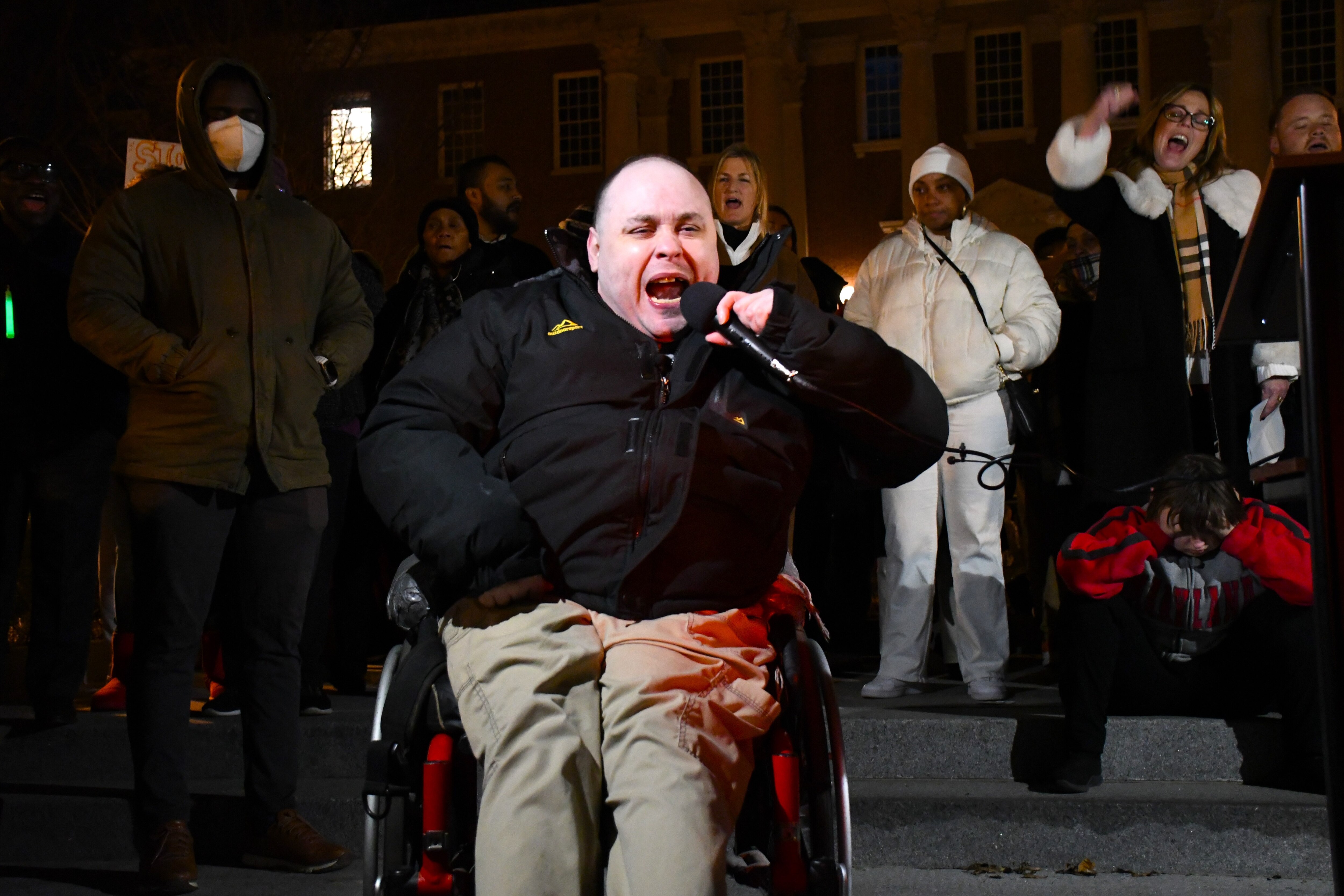Mat Rice, executive director of People on the Go Maryland, leads a crowd in chanting, "Hey, hey! Ho, ho! These budget cuts have got to go!" during a rally against proposed budget cuts for the state Developmental Disabilities Administration. The rally was held on Lawyers Mall in Annapolis on Monday, Feb. 3, 2025.