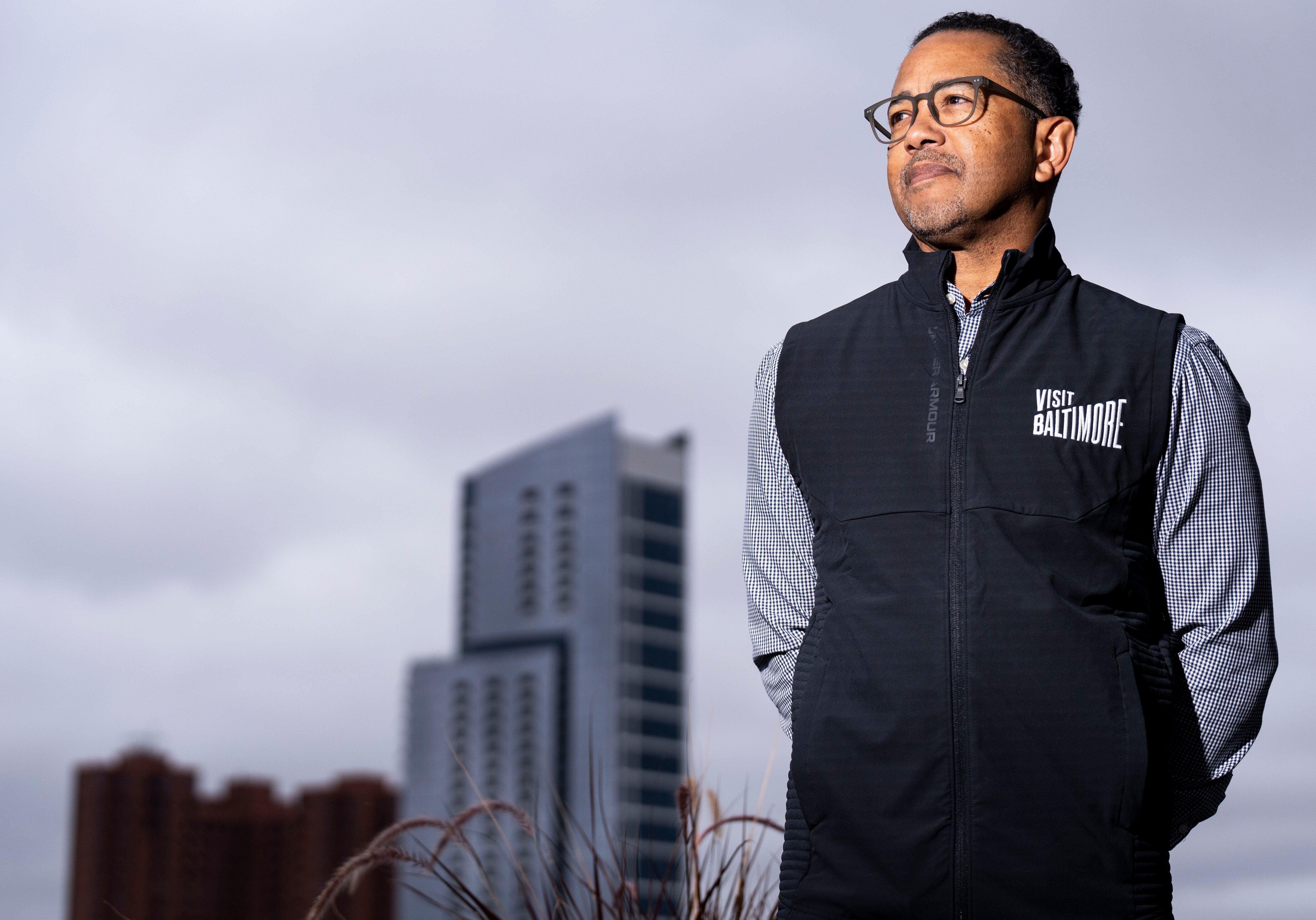 Visit Baltimore President and CEO Al Hutchinson poses for a portrait on a balcony at his office, in Baltimore, Monday, October 24, 2022.
