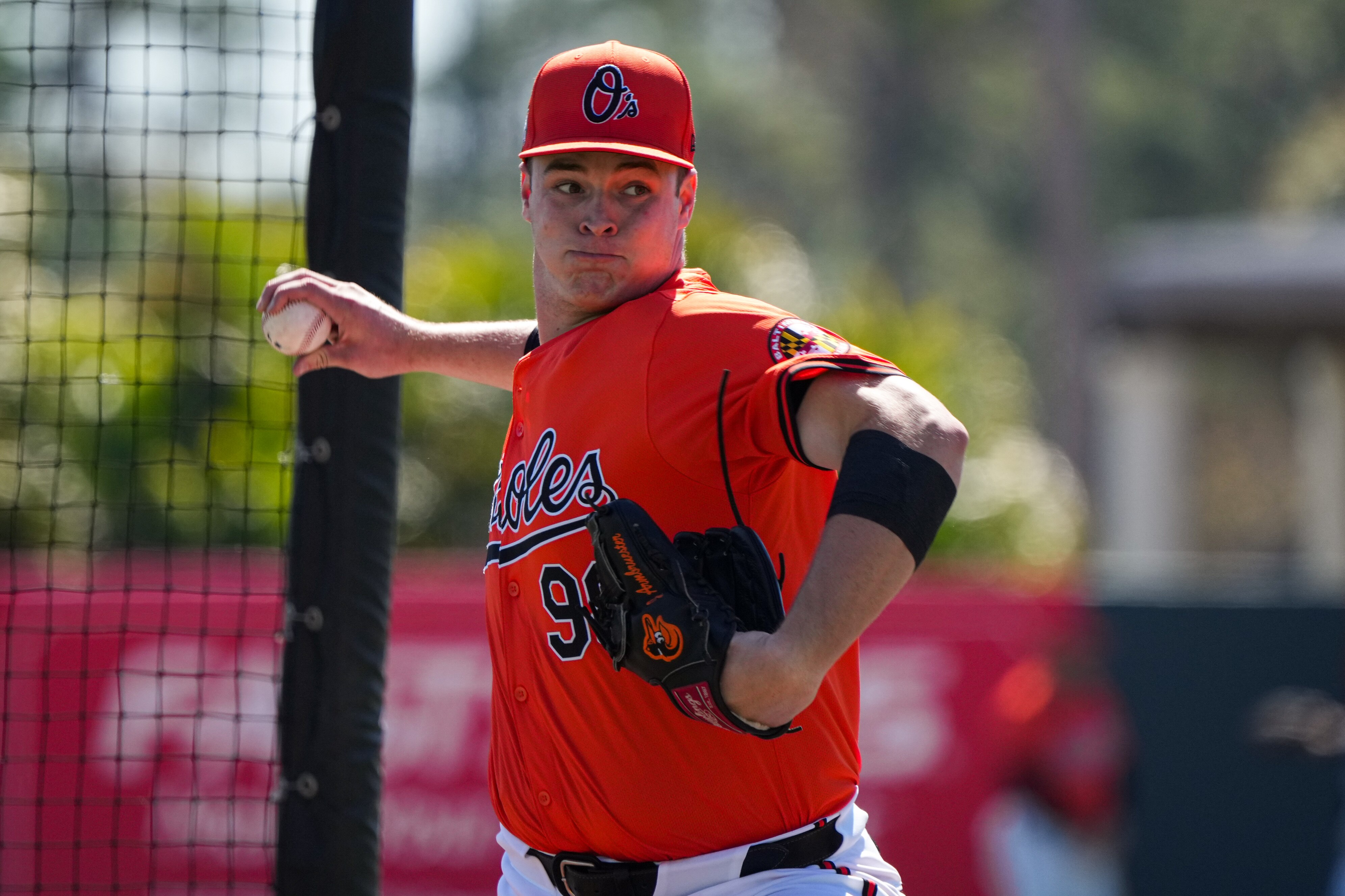 Baltimore Orioles pitcher Justin Armbruester (98) throws during the team’s spring training practice at Ed Smith Stadium on Feb. 20, 2024.