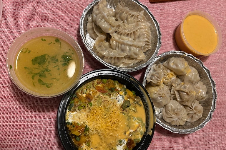 Buffalo and chicken momo from Taste of Taj in Nottingham, ordered with a cold soup for dipping. The samosa chat looked and tasted like a Nepali spin on a seven-layer dip, and in the best way.