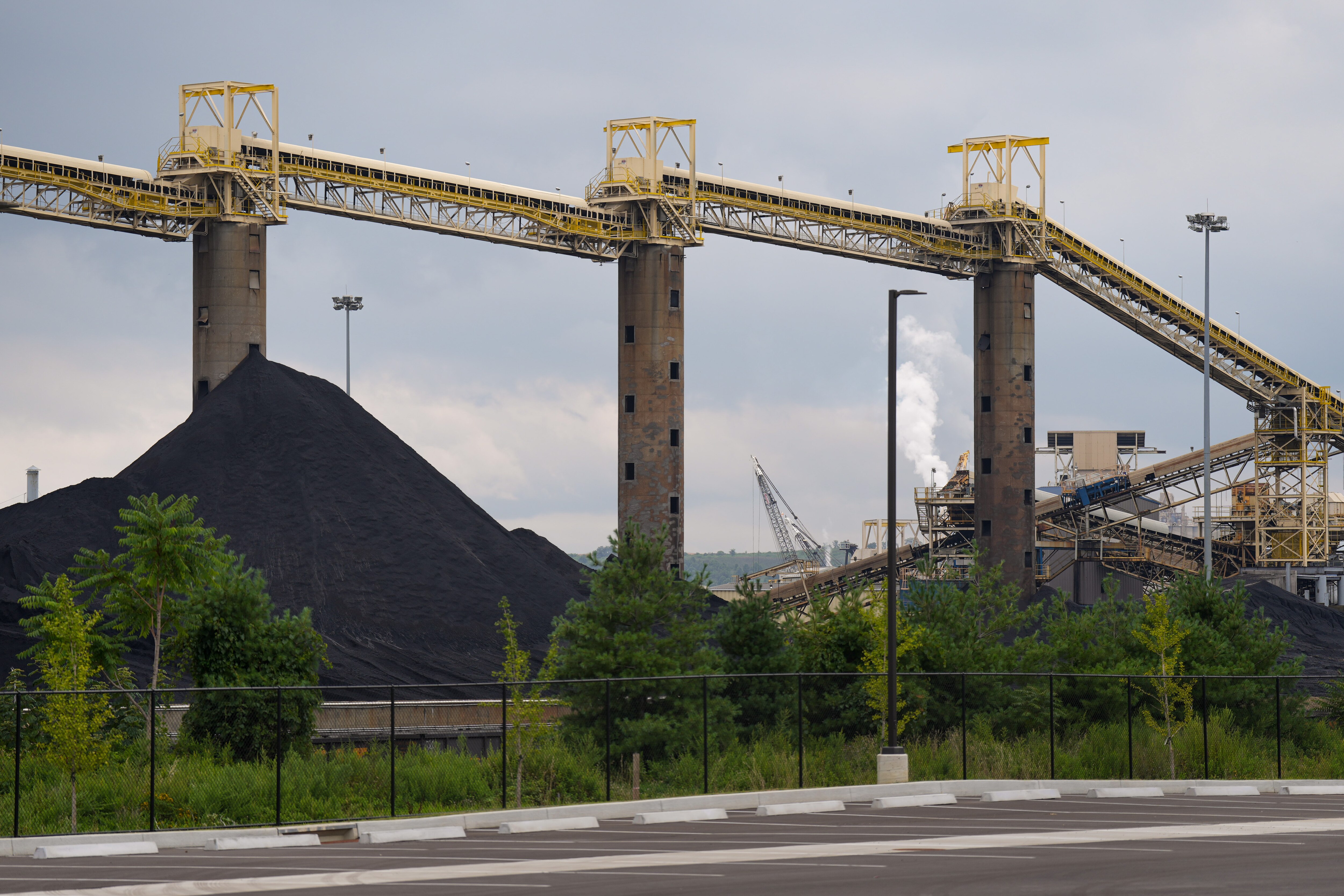 A few miles from the CSX facility in Curtis Bay, two coal-burning power plants may run for years longer than planned.