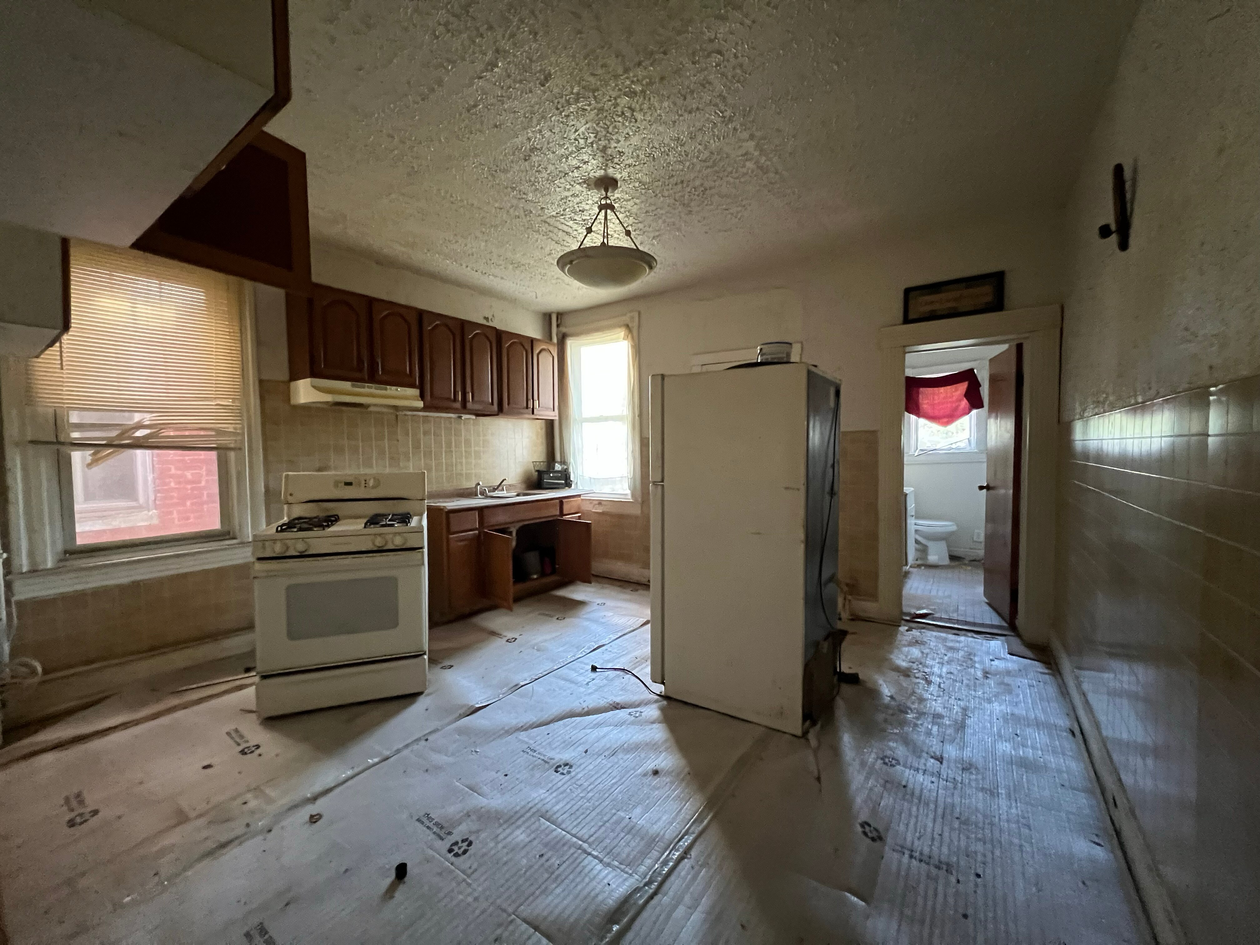The interior of a West Baltimore home, located in the Rosemont neighborhood, bought by an ABC Capital investor. The locks were being changed by a man who said the home is going to tax auction.