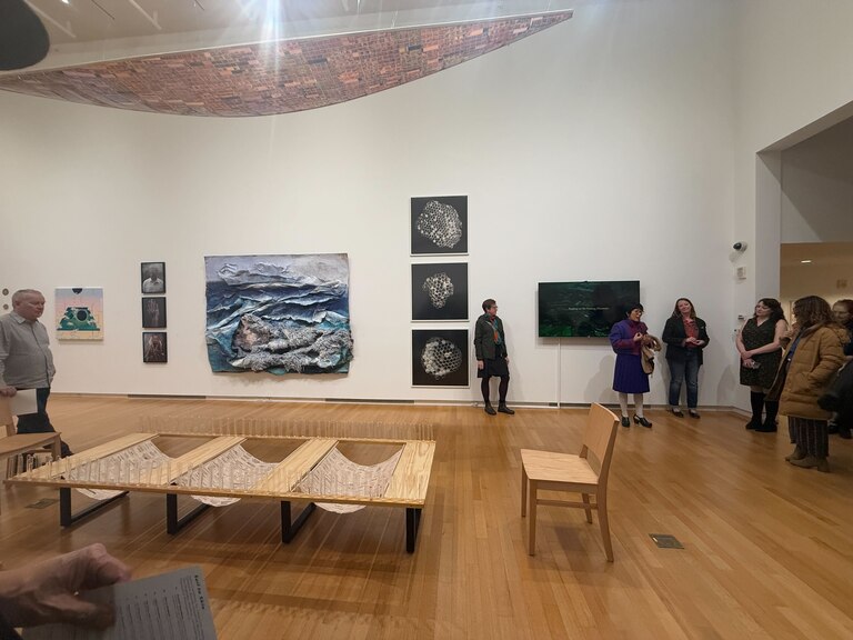 The opening reception for "Soil to Skin" at Silber Art Gallery in the Goucher College Athenaeum.