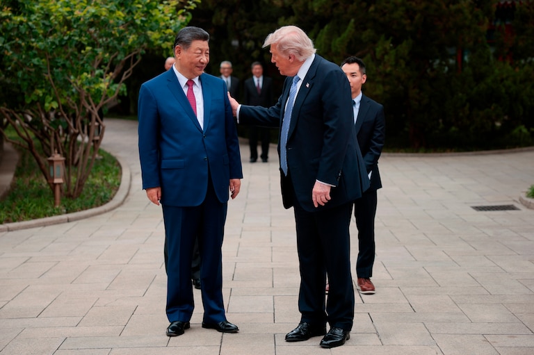 President Donald Trump speaks with Chinese President Xi Jinping, left, while leaving after a visit to the Zhongnanhai Garden in Beijing, Friday, May 15, 2026.