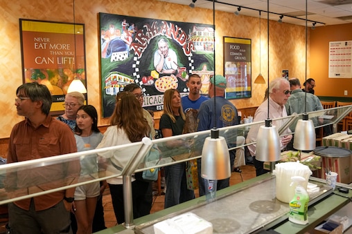 Customers place their orders at the counter of Armand's Pizzeria & Grille in Rockville, Md. on Wednesday, June 17, 2026. After more than 50 years in business, the pizza shop will close its doors this week.