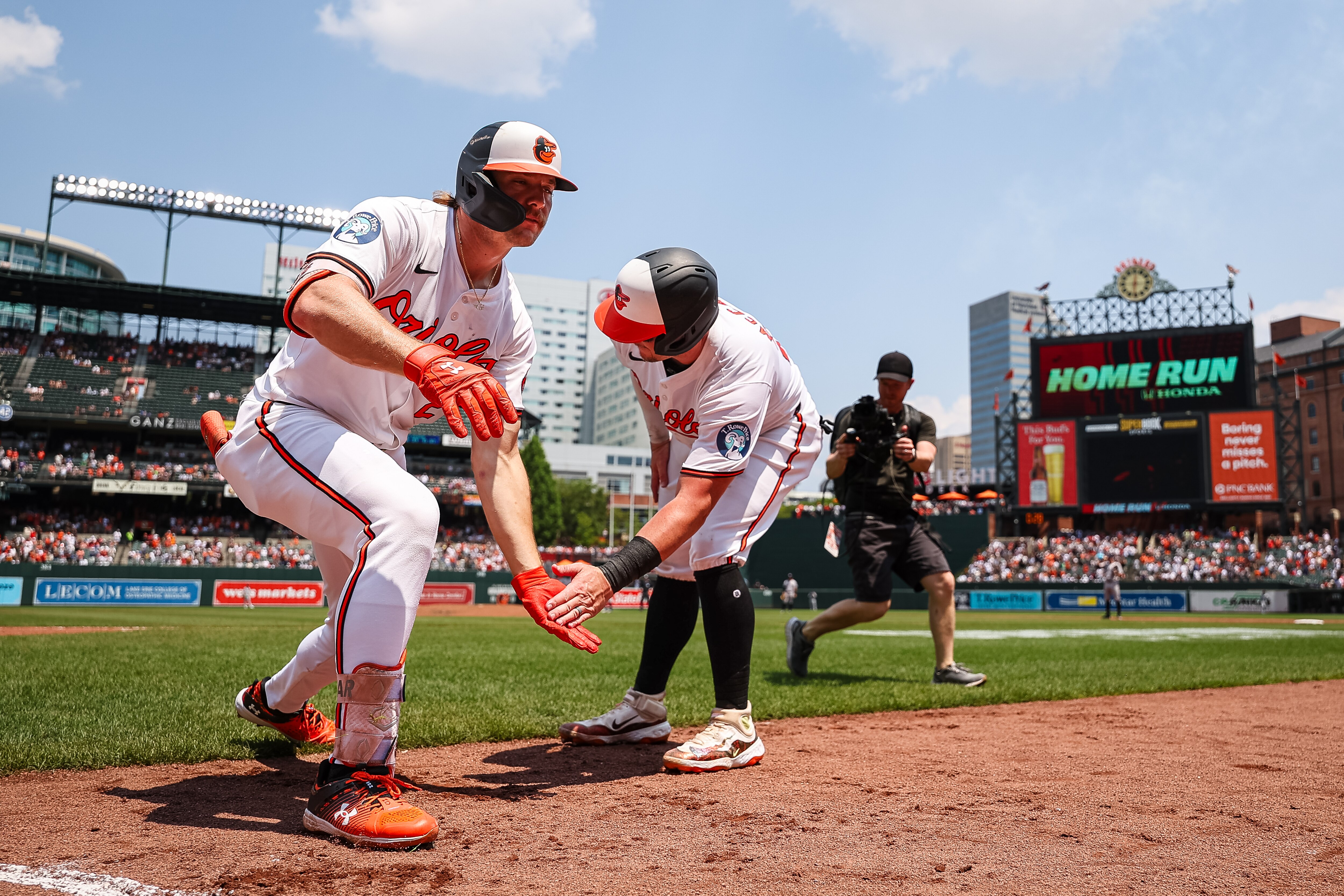 BALTIMORE, MD - JULY 14: Gunnar Henderson #2 of the Baltimore Orioles celebrates with James McCann #27 after hitting a two-run home run against the New York Yankees during the third inning at Oriole Park at Camden Yards on July 14, 2024 in Baltimore, Maryland. (Photo by Scott Taetsch/Getty Images)