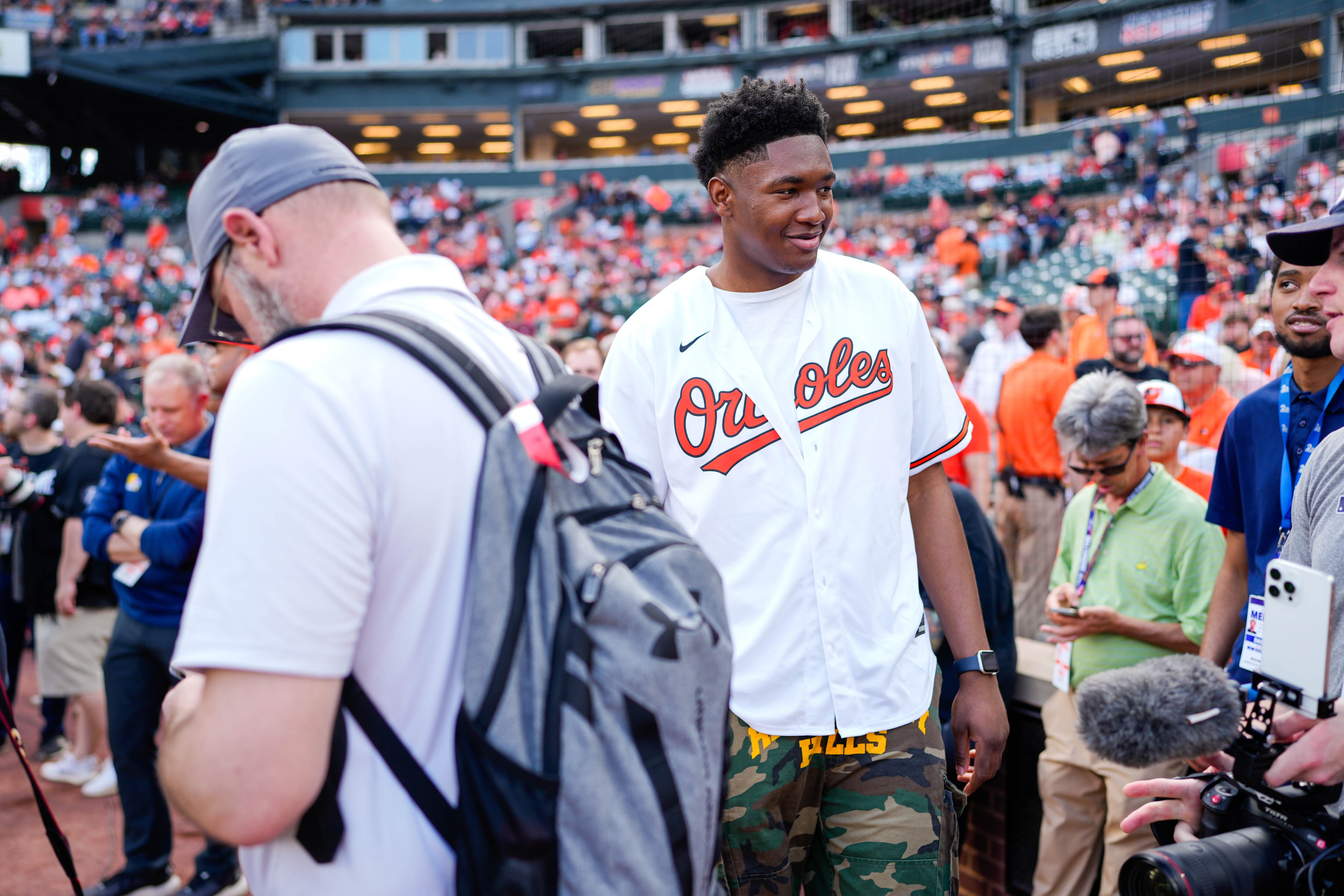 University of Maryland basketball player Derik Queen takes part in pregame festivities ahead of the Baltimore Orioles’ home opening game against the Boston Red Sox in March.