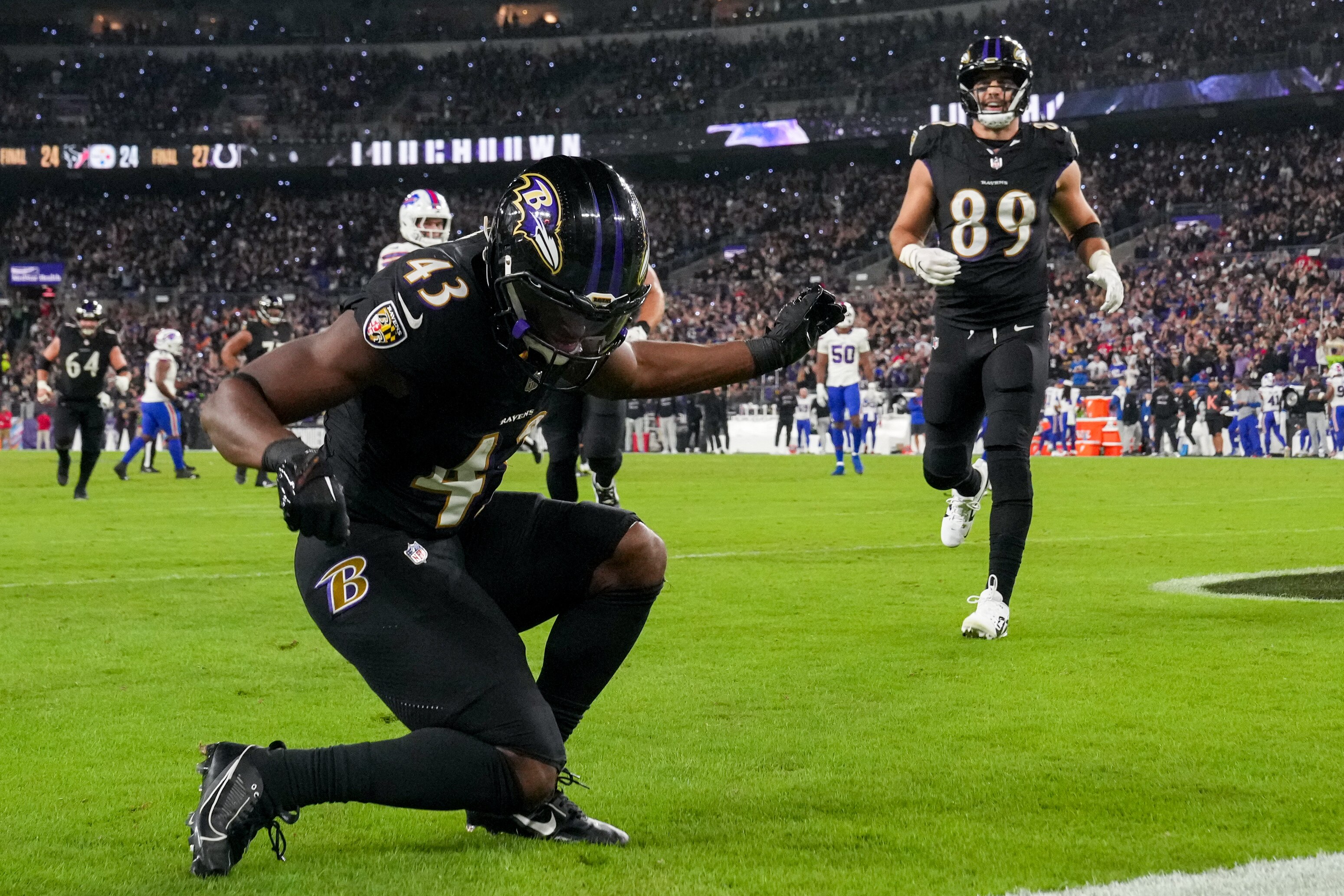 The Bills responded to the Ravens’ physicality by putting more size on the field, which created space for Justice Hill, shown here after his 19-yard TD pass.