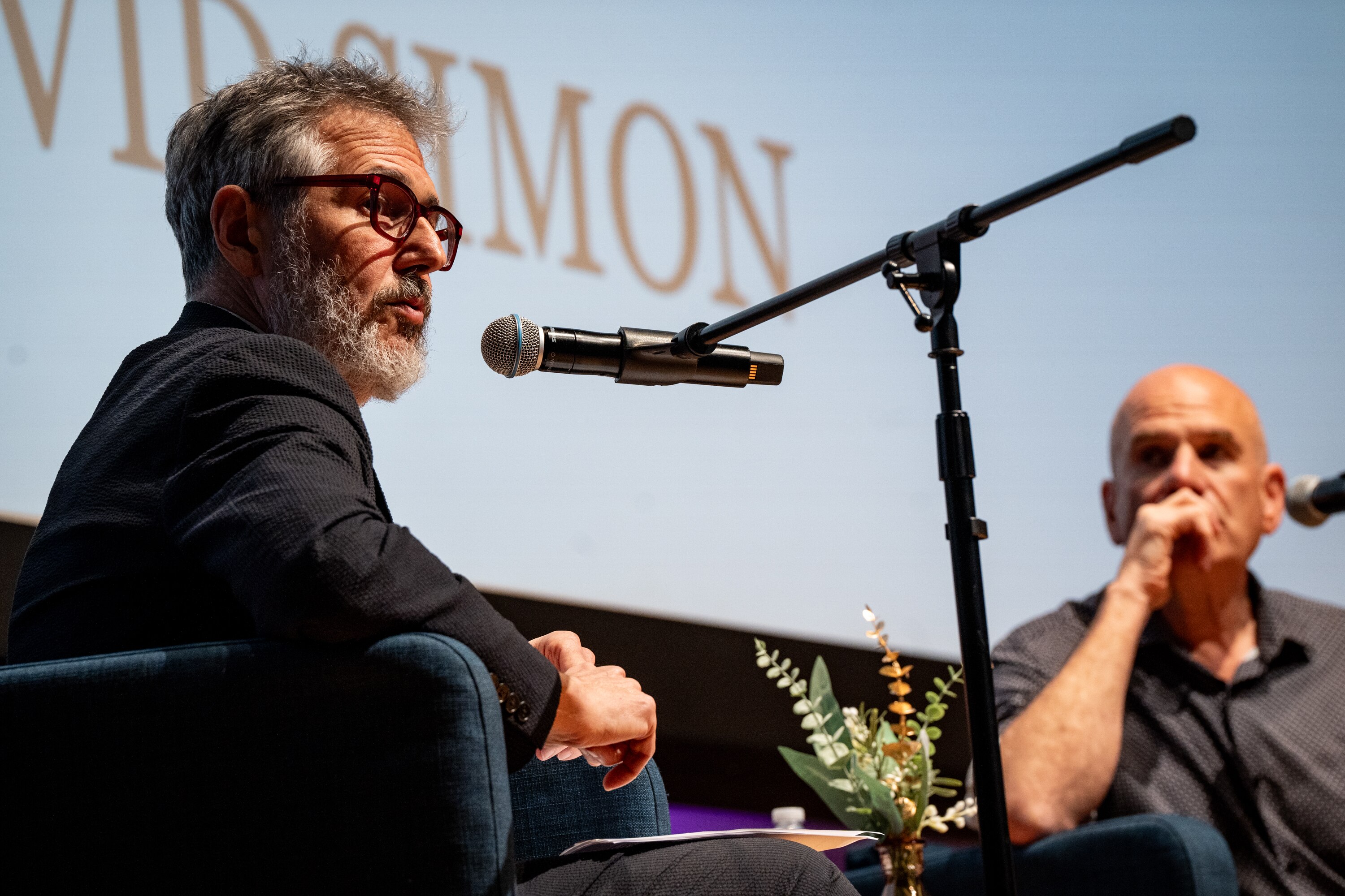 Ira Glass and David Simon in conversation at “The Art of the Story: A Conversation with Ira Glass and David Simon,” presented by The Baltimore Banner and WYPR at the MICA Brown Center in Baltimore.